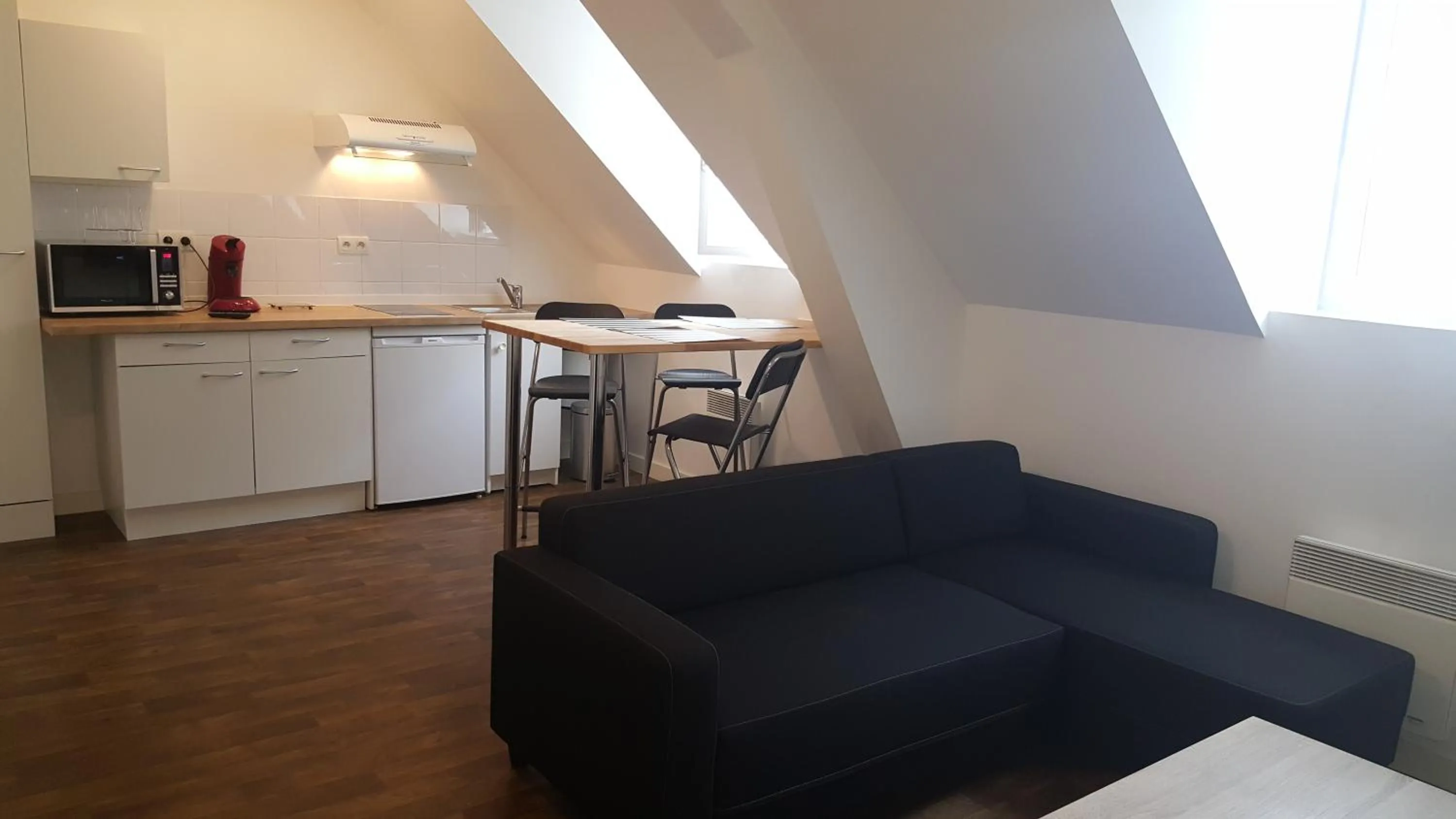 Seating area in Au Pigeon Blanc