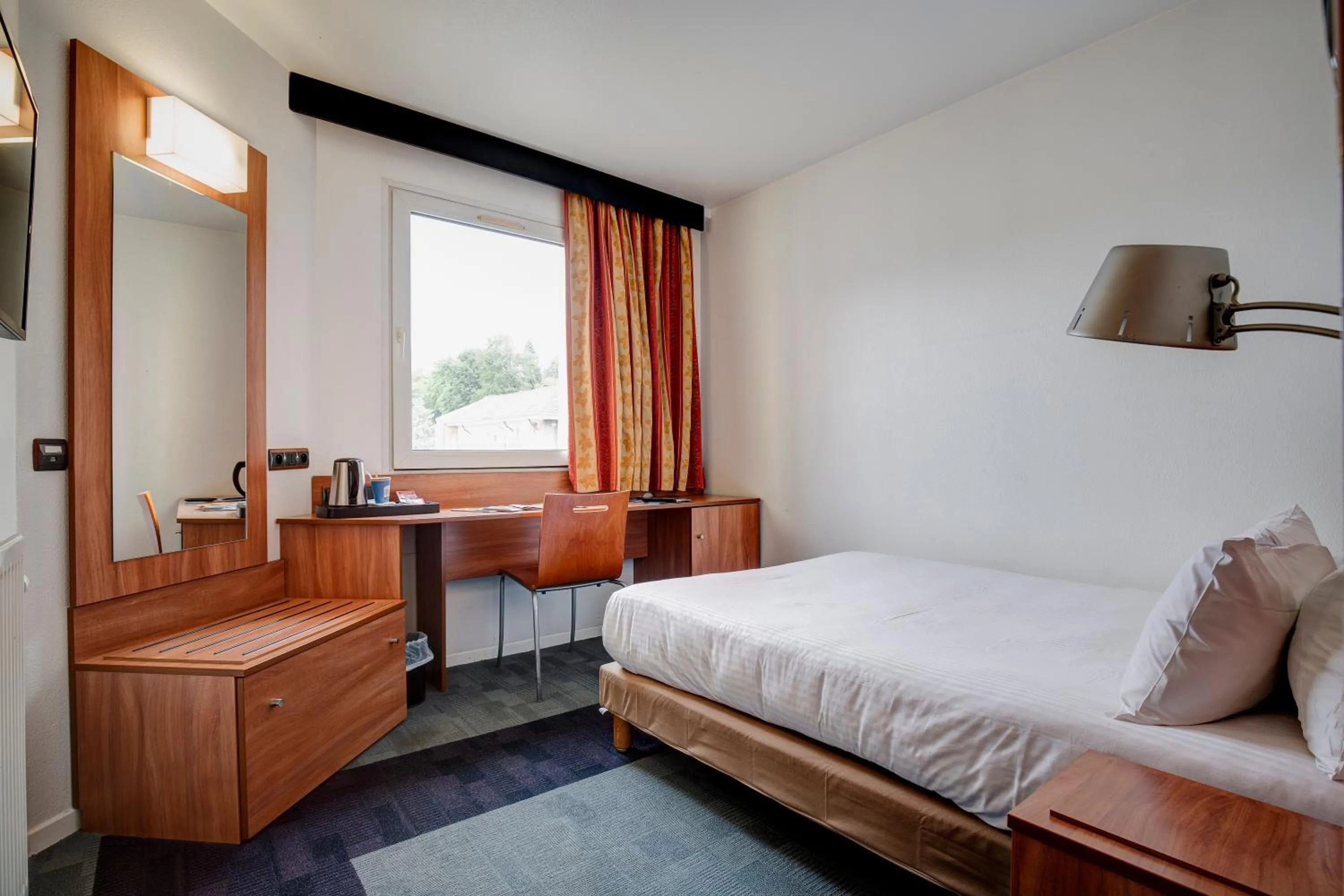 Bed in Kyriad Montbeliard Sochaux