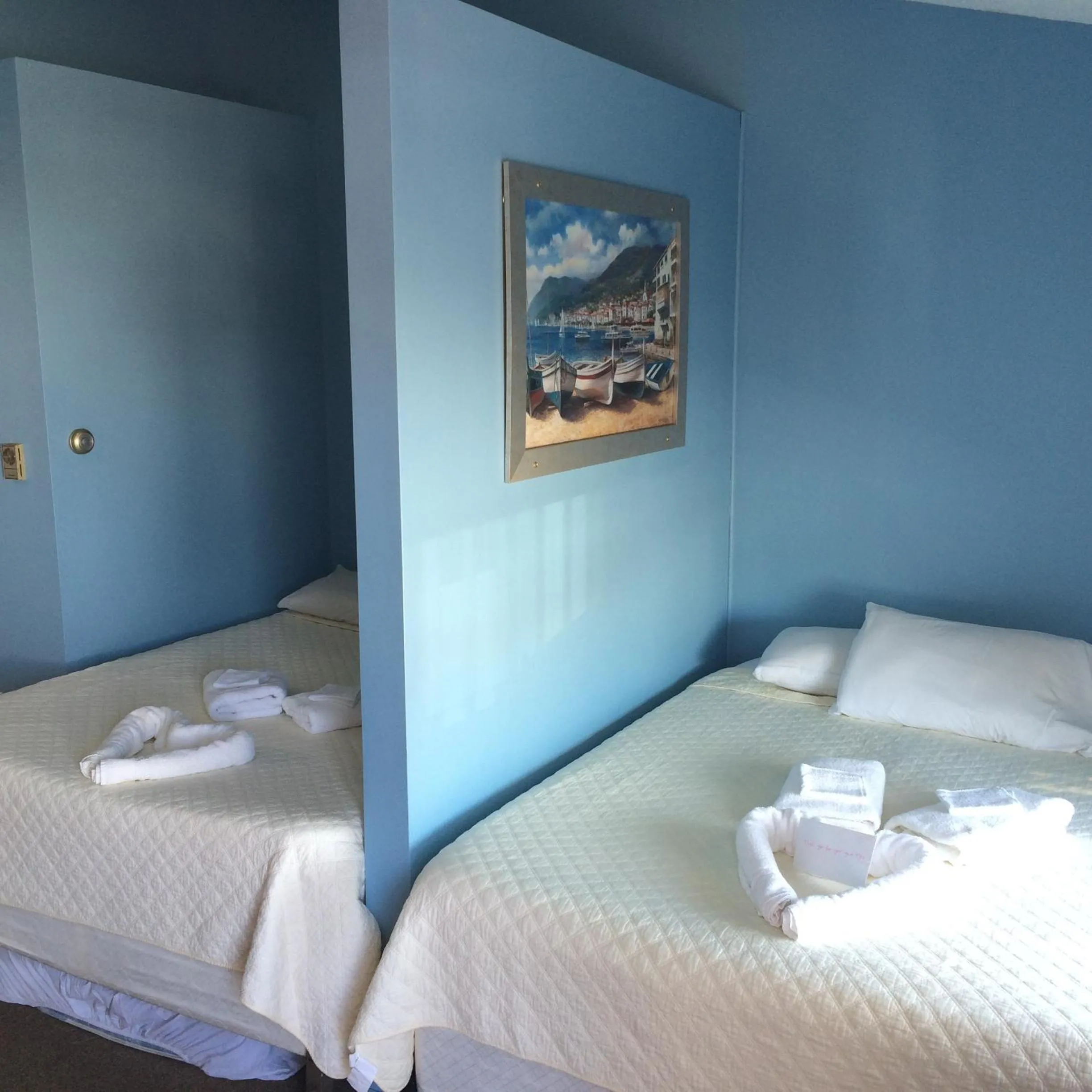 Bed in The New Oceanic Inn
