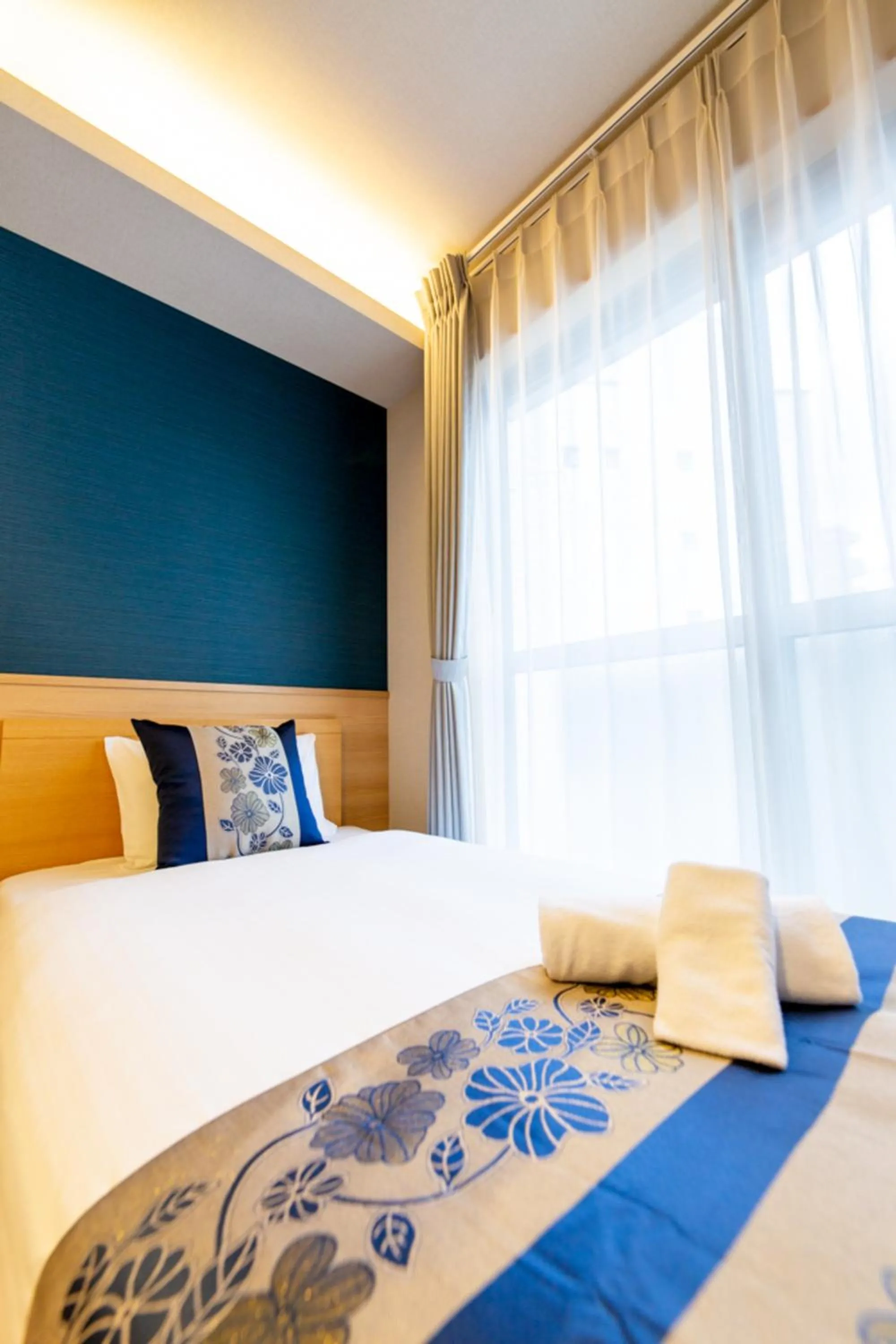 Bed in GRAND BASE Hiroshima Hikarimachi