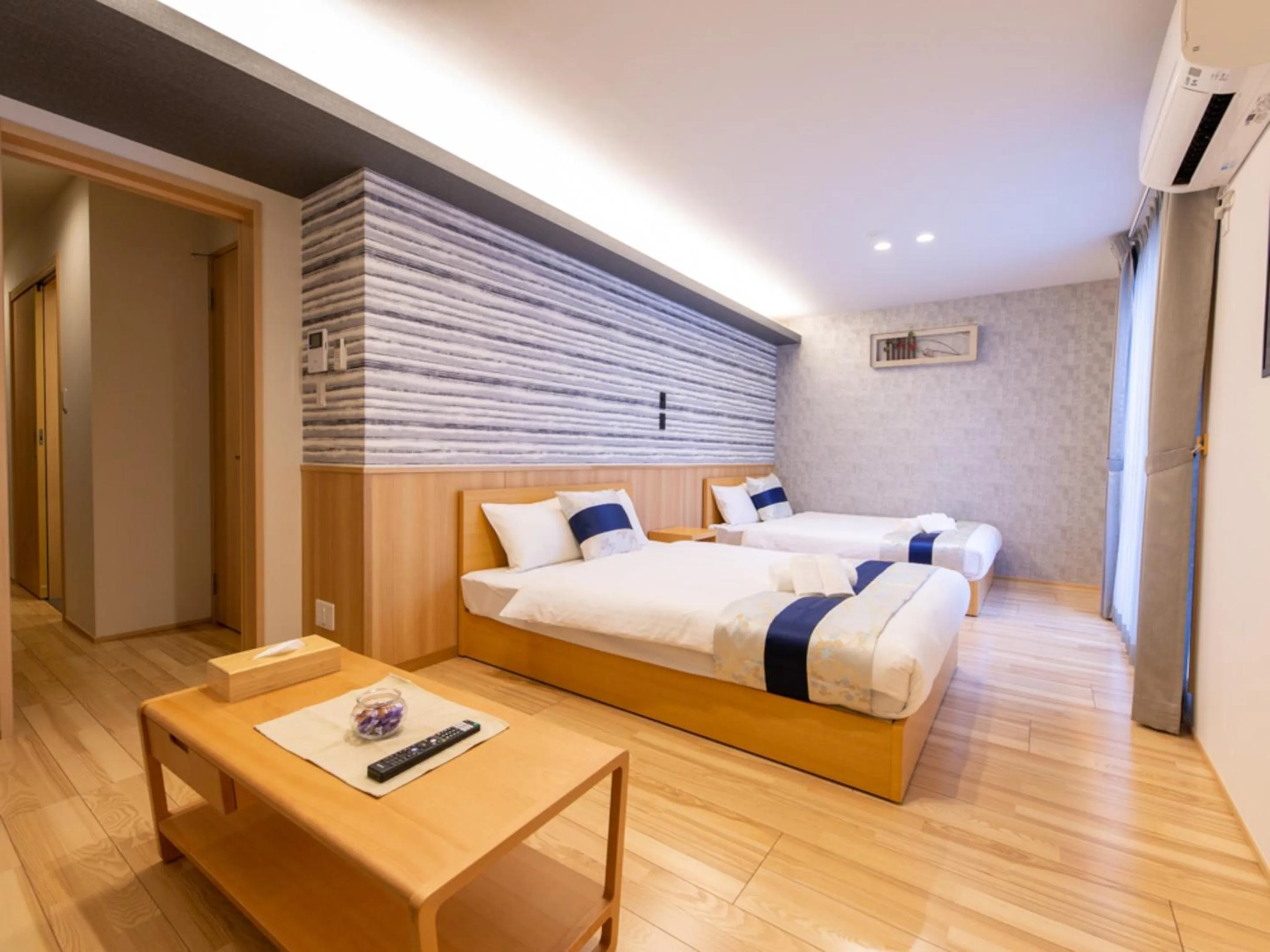 Photo of the whole room, Bed in GRAND BASE Hiroshima Hikarimachi