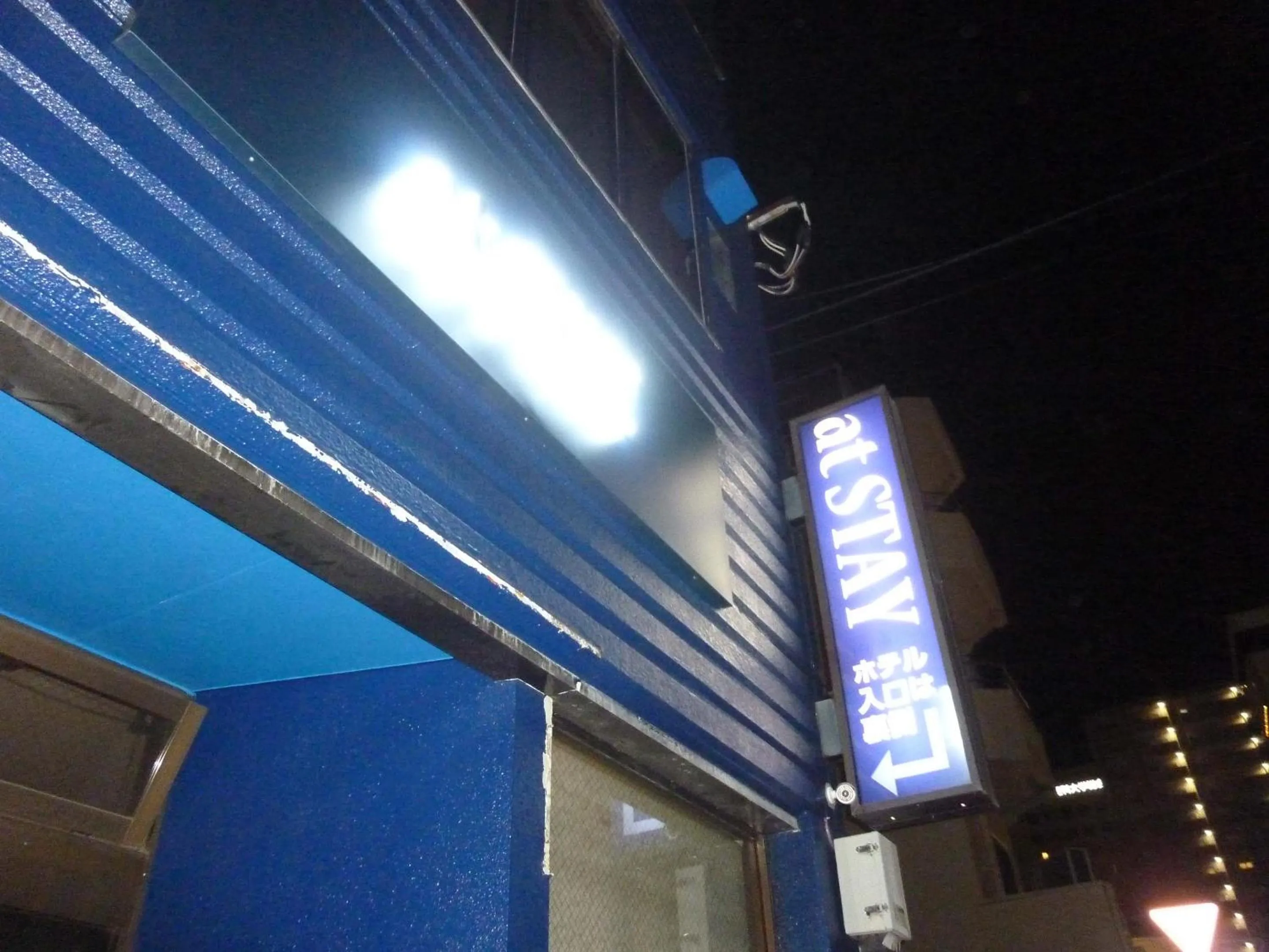 Property logo or sign in At Stay