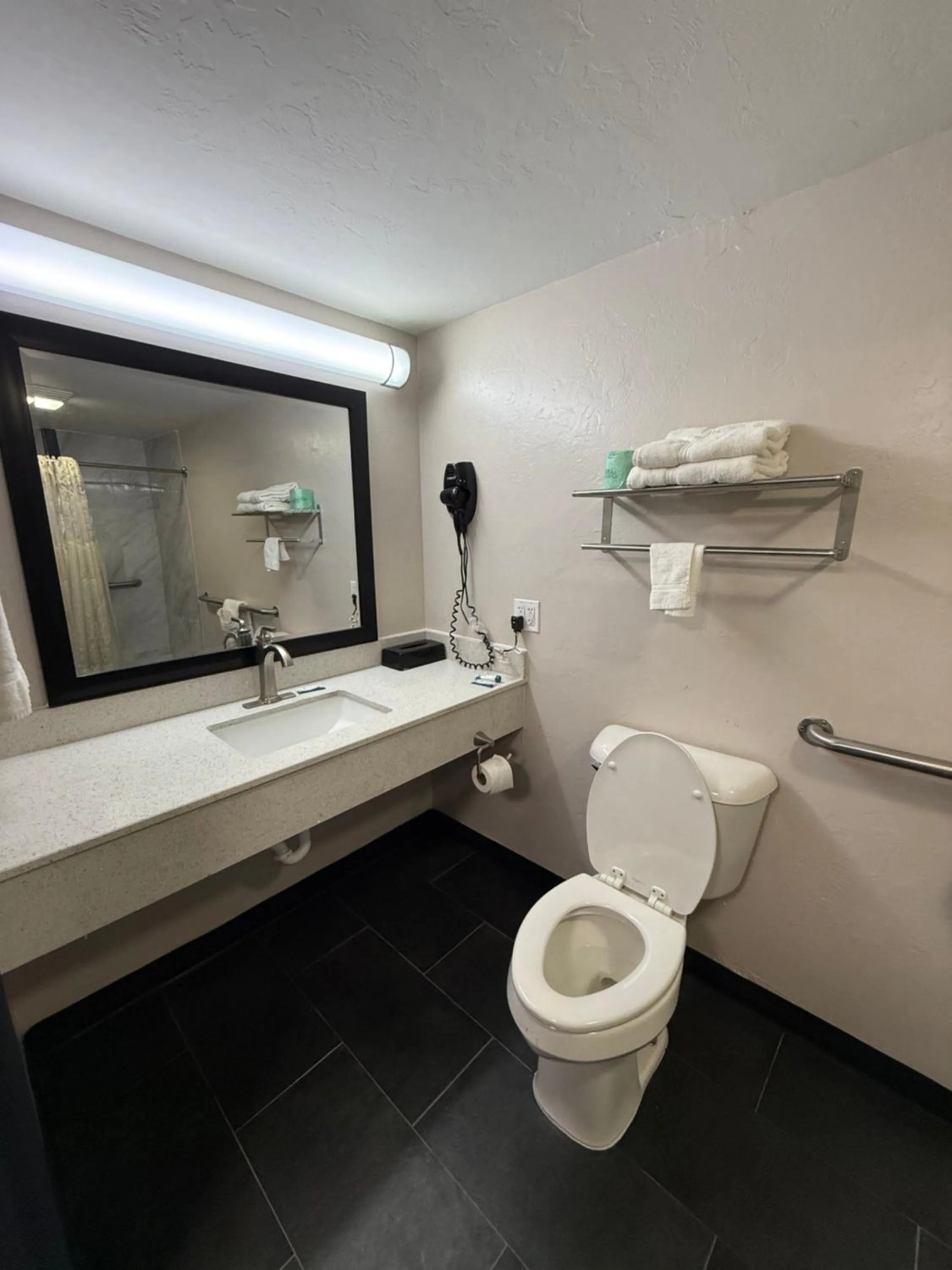 Toilet in Americas Best Value Inn Ponca City