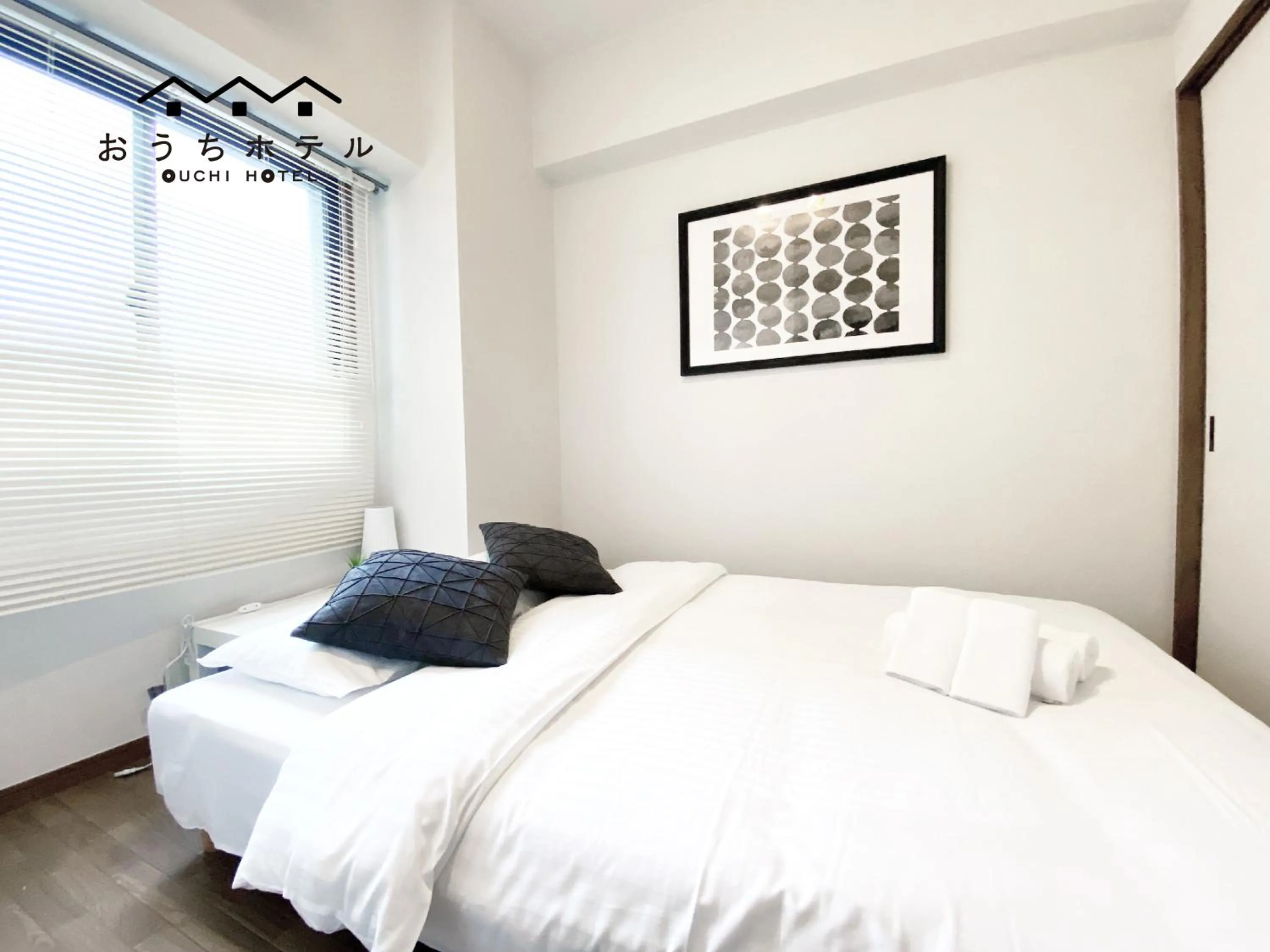 Bed in OUCHI HOTEL Dambara