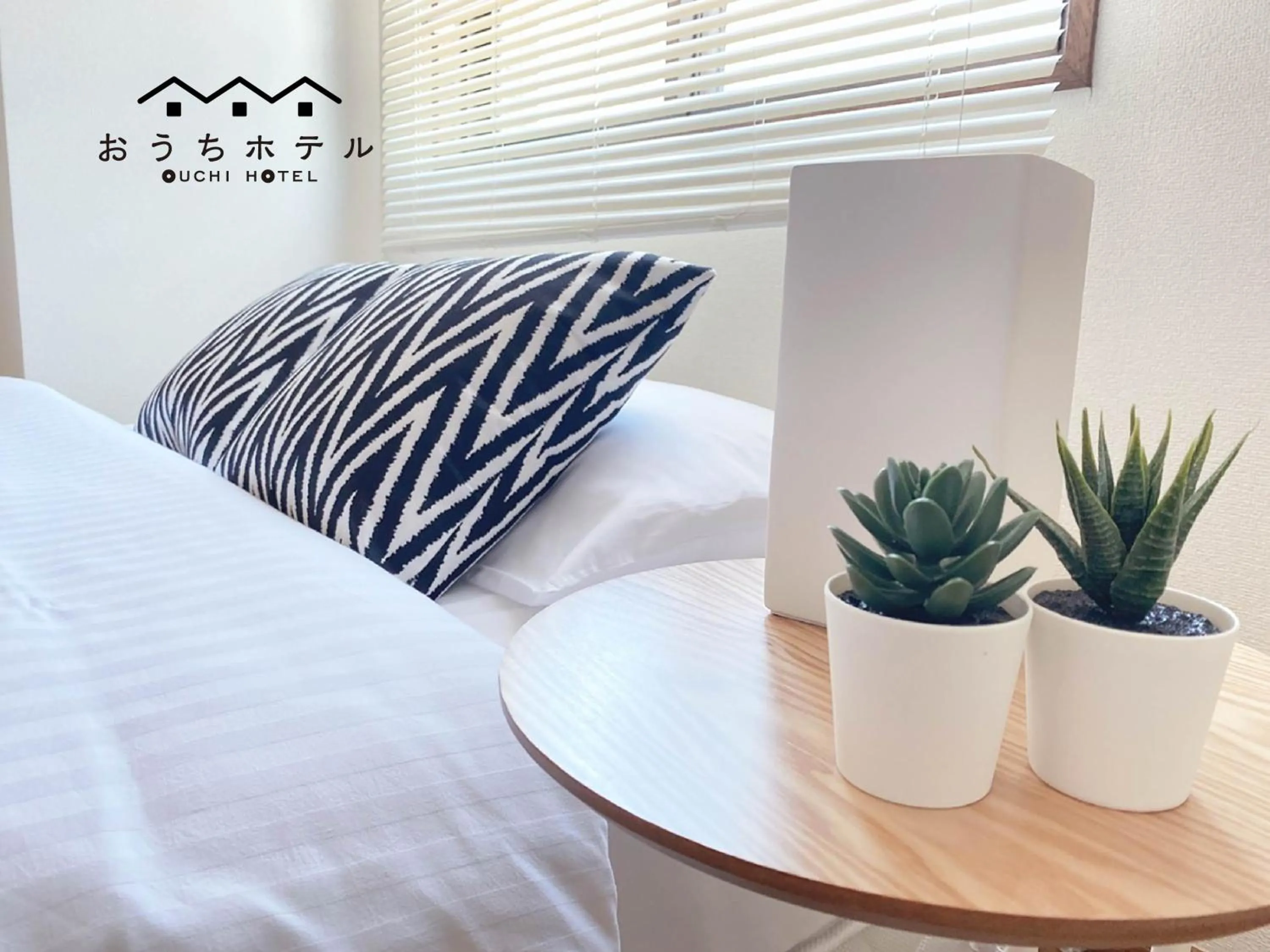 Bed in OUCHI HOTEL Dambara