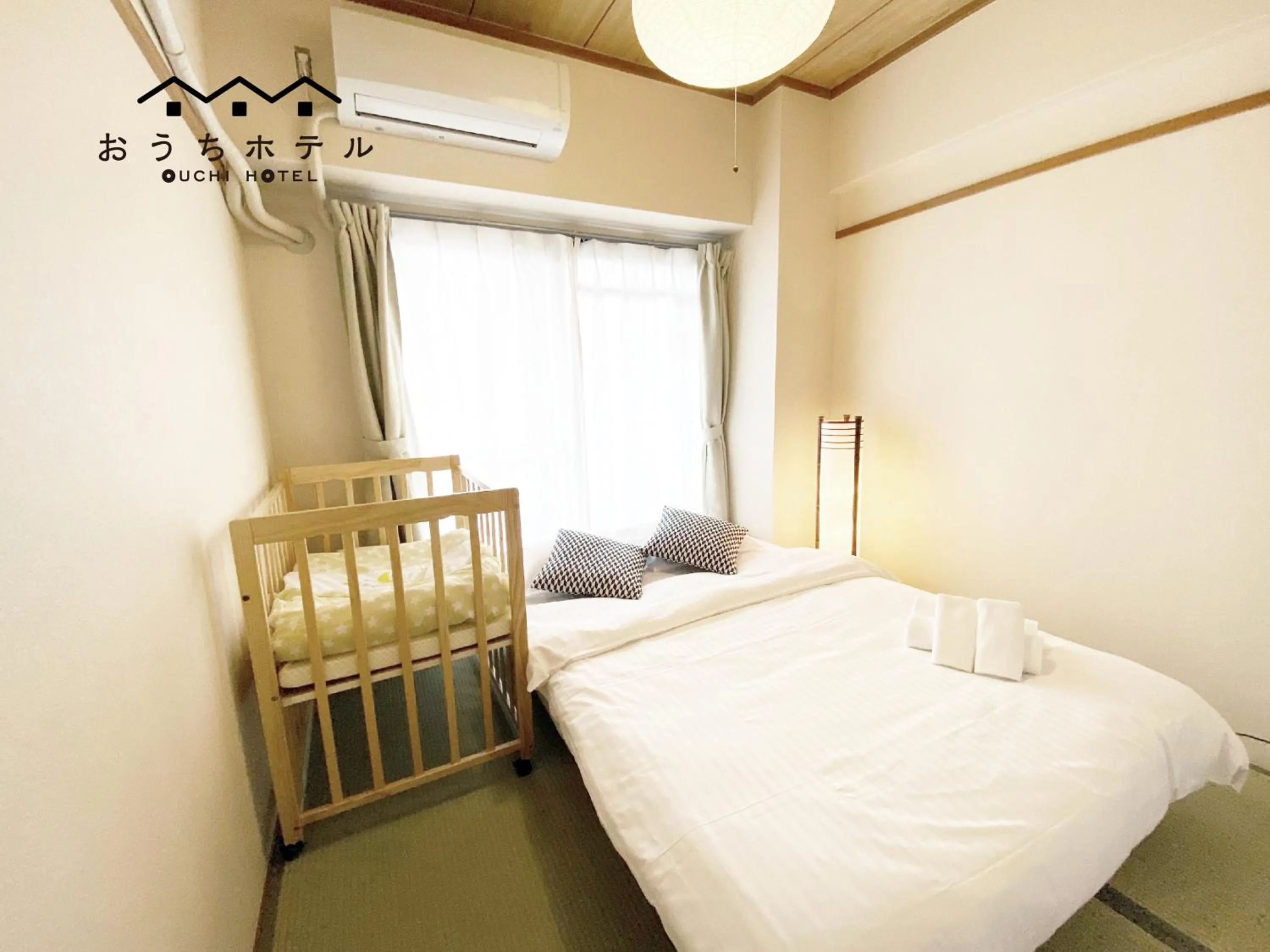 Bed in OUCHI HOTEL Dambara