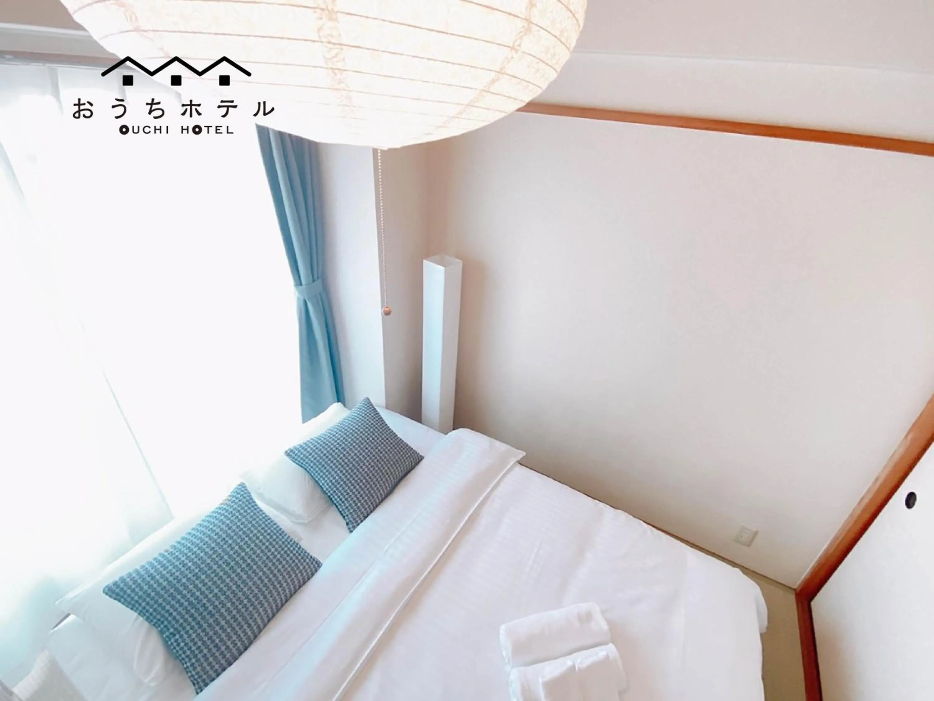 Bed in OUCHI HOTEL Dambara