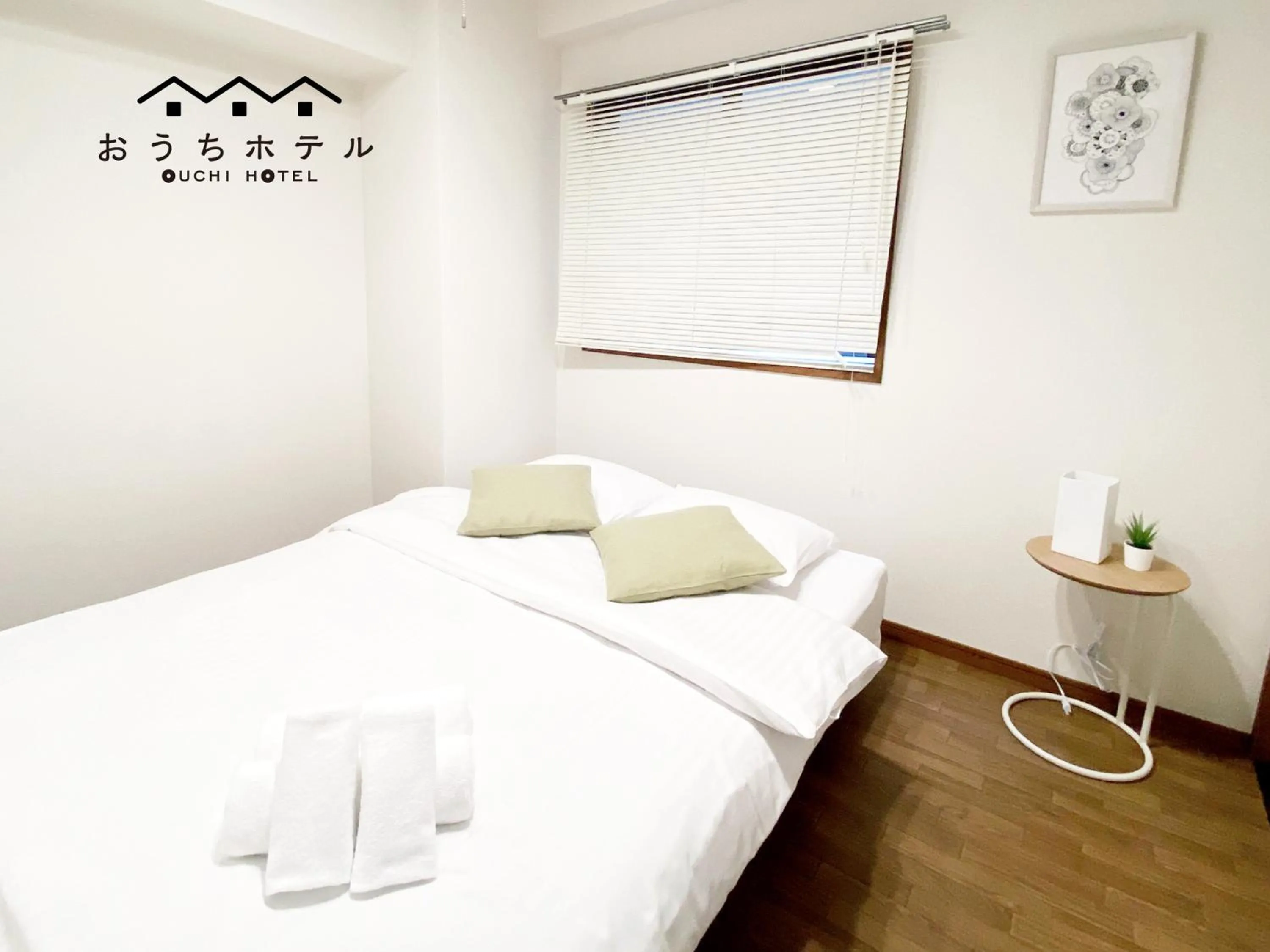 Bed in OUCHI HOTEL Dambara