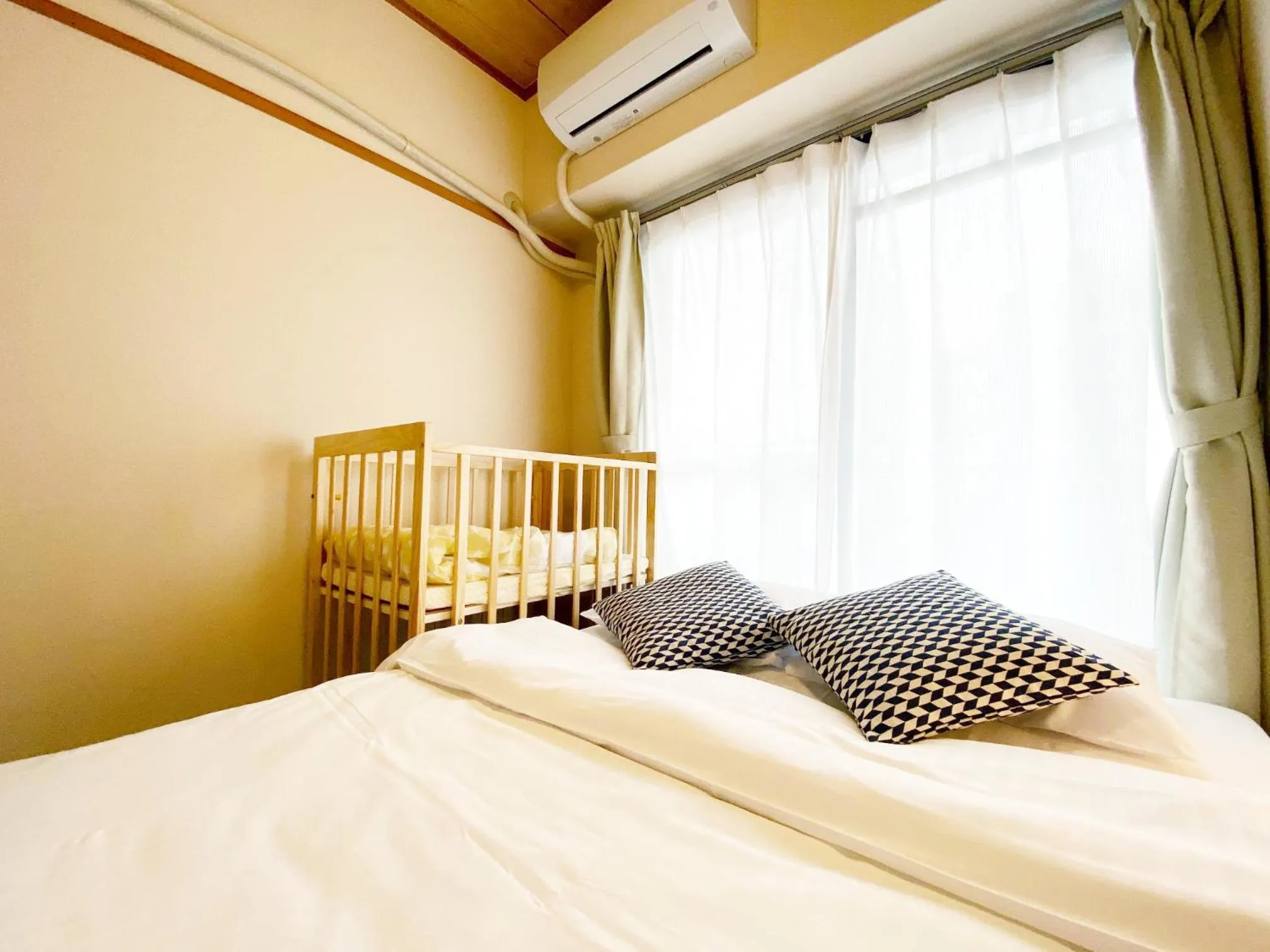 Bed in OUCHI HOTEL Dambara