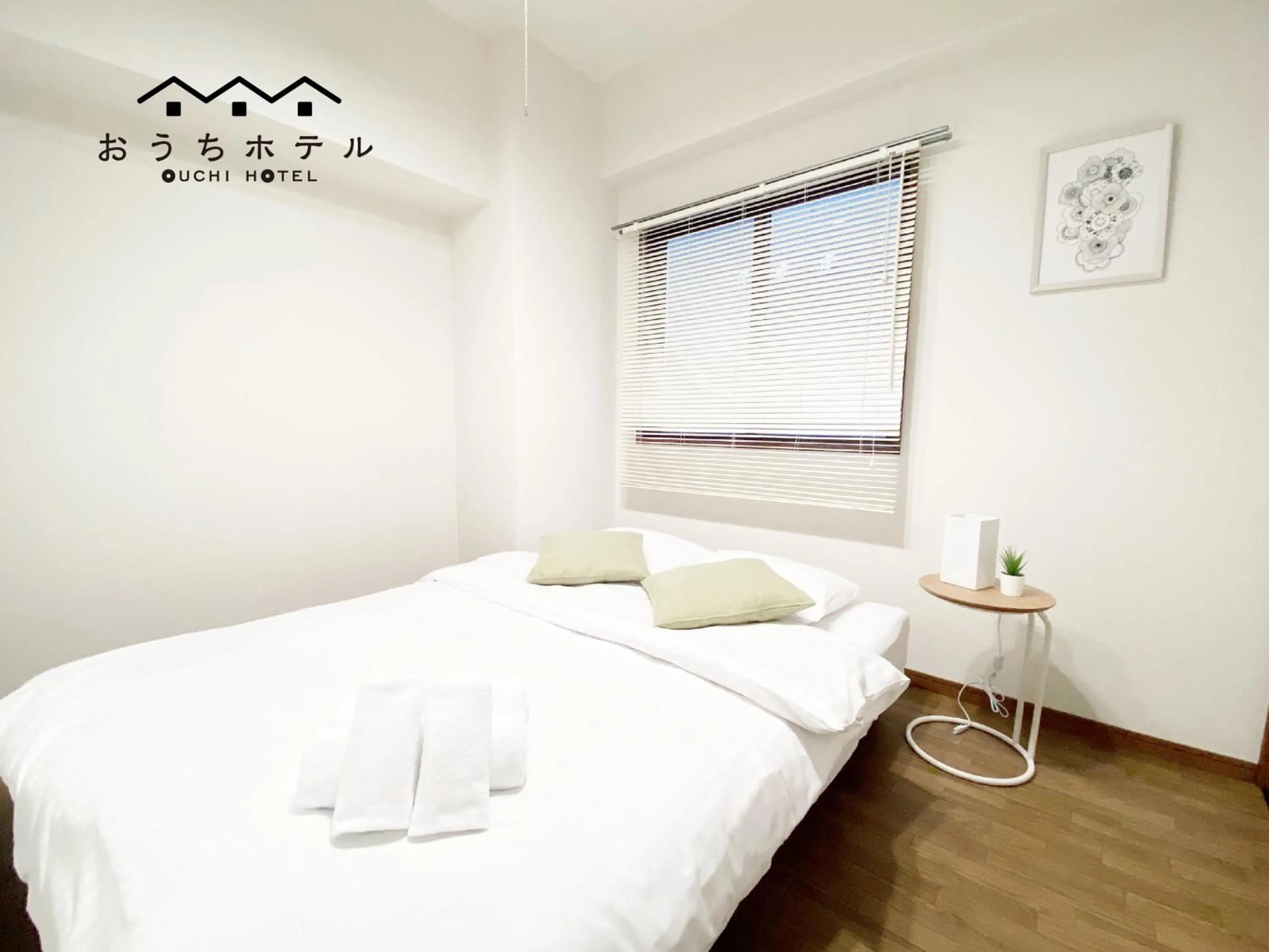 Bed in OUCHI HOTEL Dambara