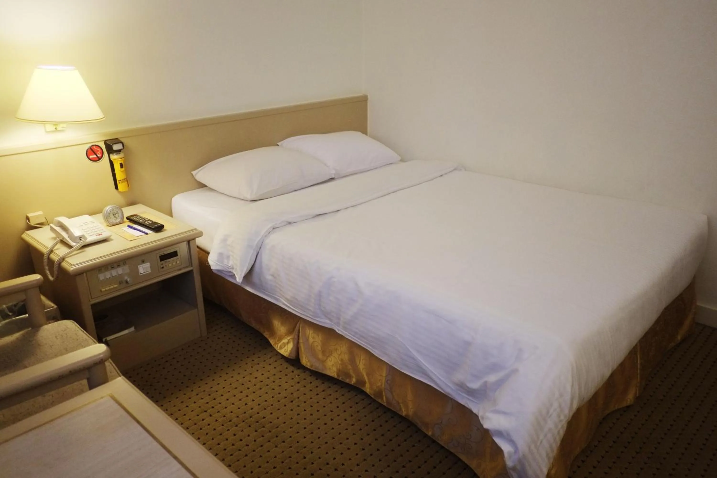 Bed in Emperor Hotel