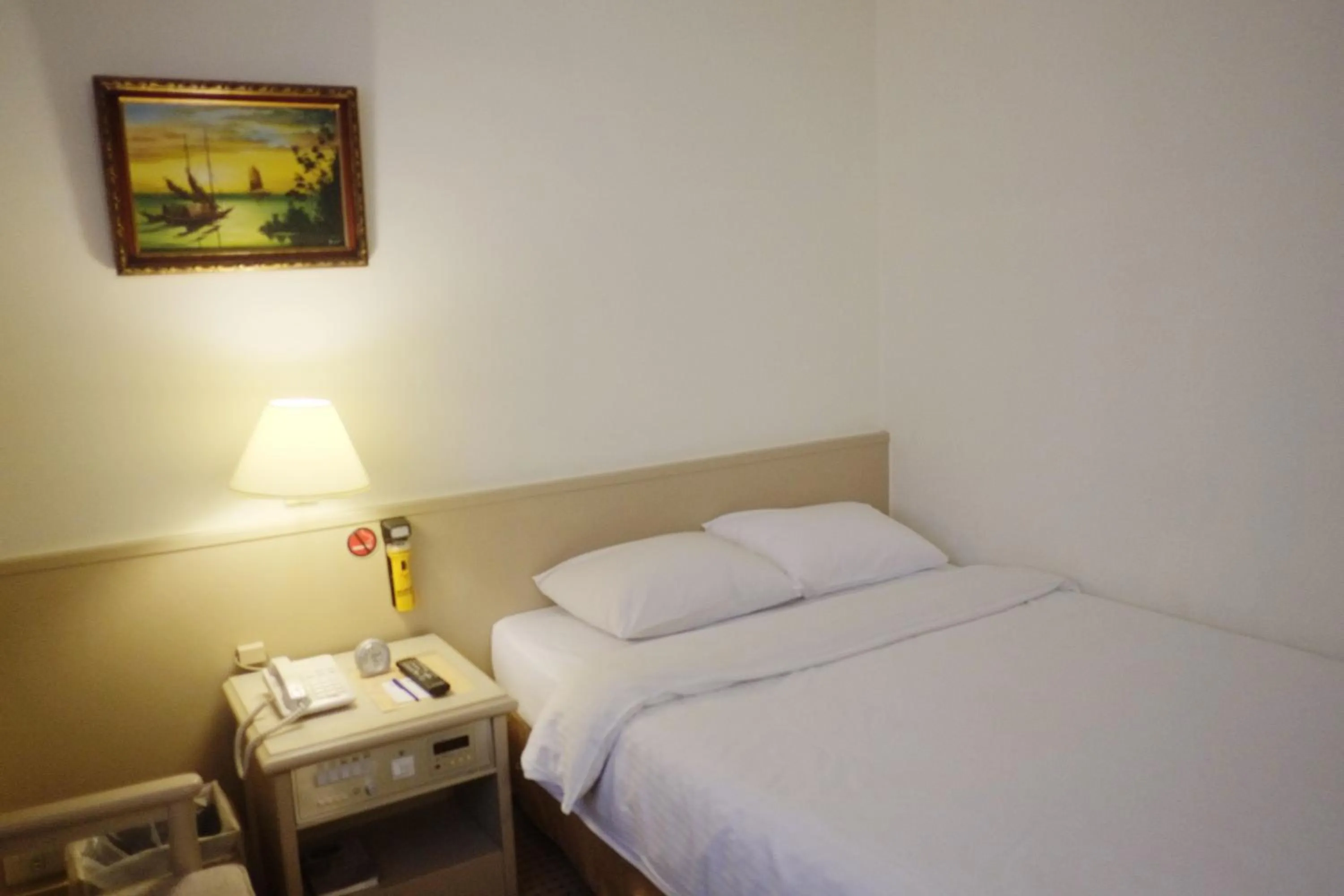 Bed in Emperor Hotel