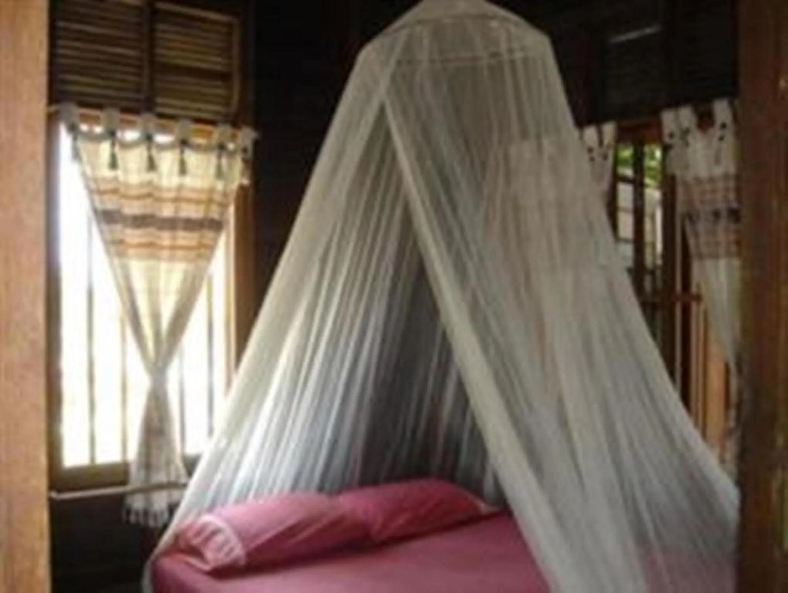 Bed in Ayothaya Riverside House
