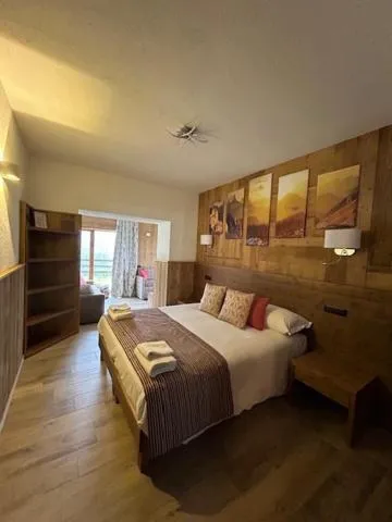 Bed in Edelweiss Hotel Champoluc