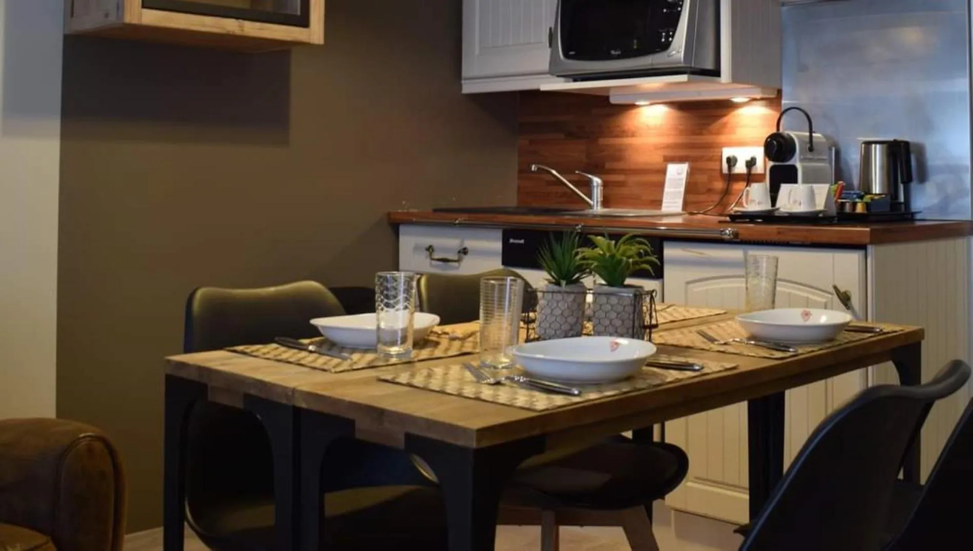 Kitchen or kitchenette in La Loggia Appart'Hôtel & Spa