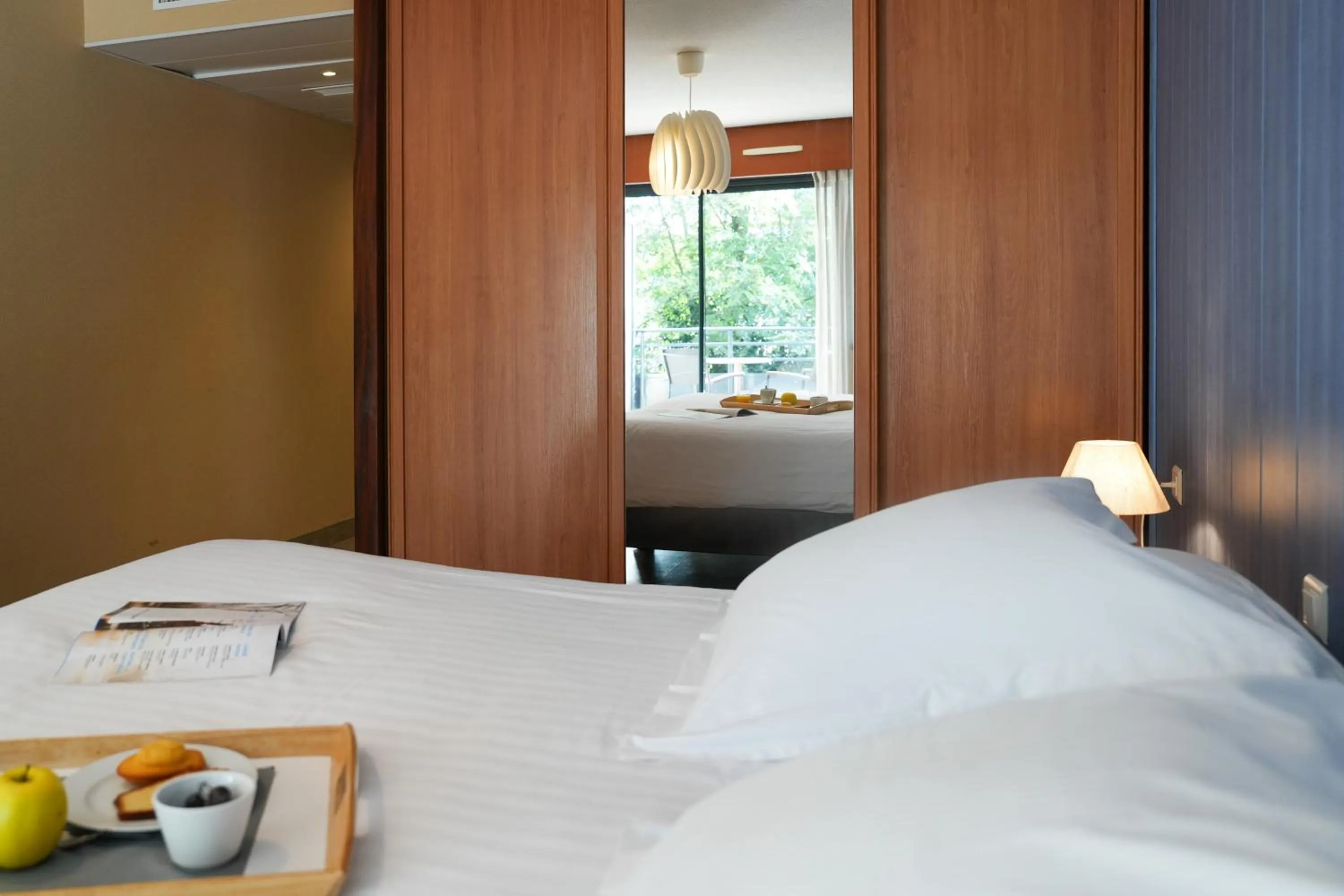 Bed in Hotel Le Pavillon Bleu