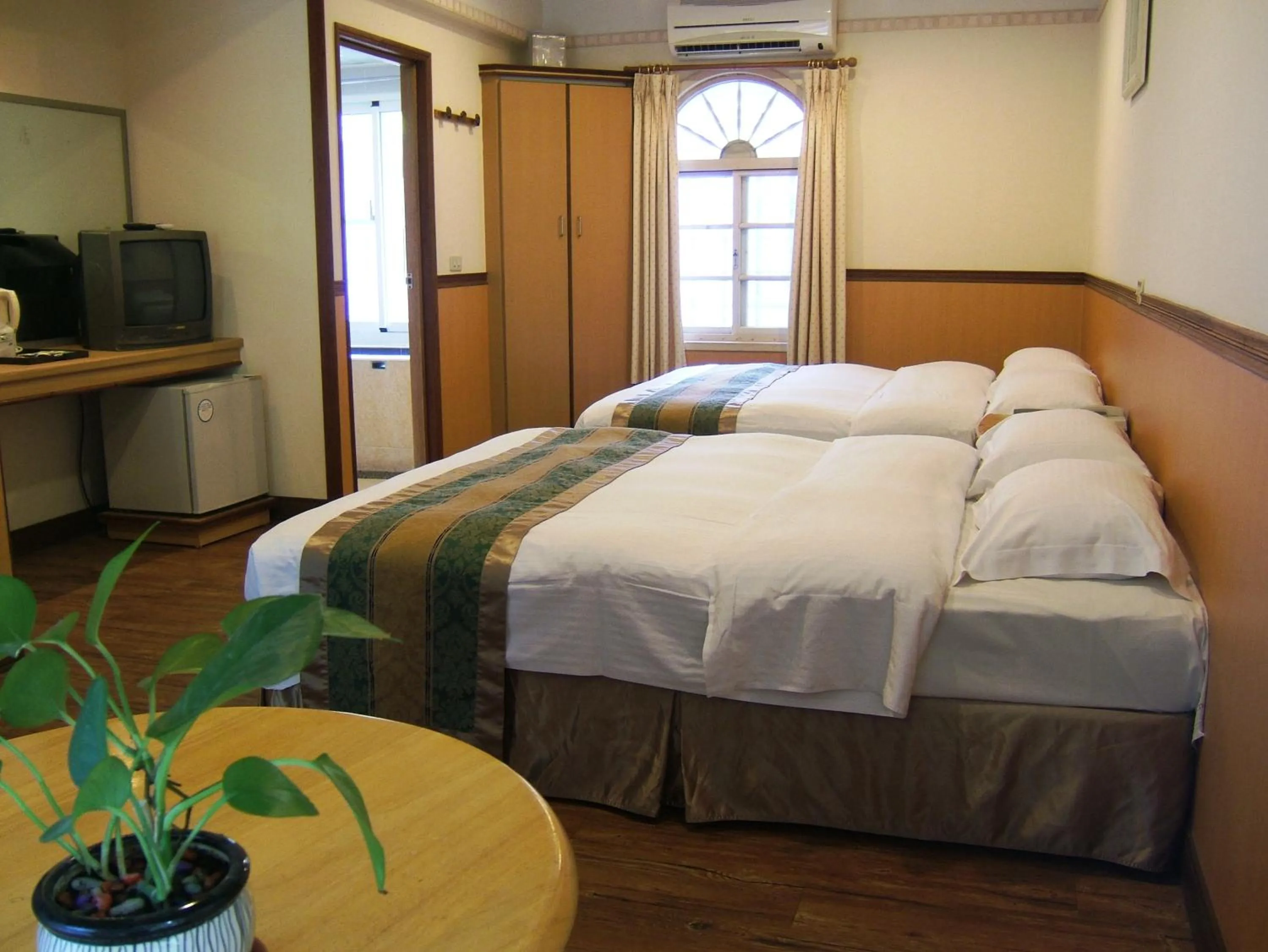 Bed in Rainbow Resort Hotel