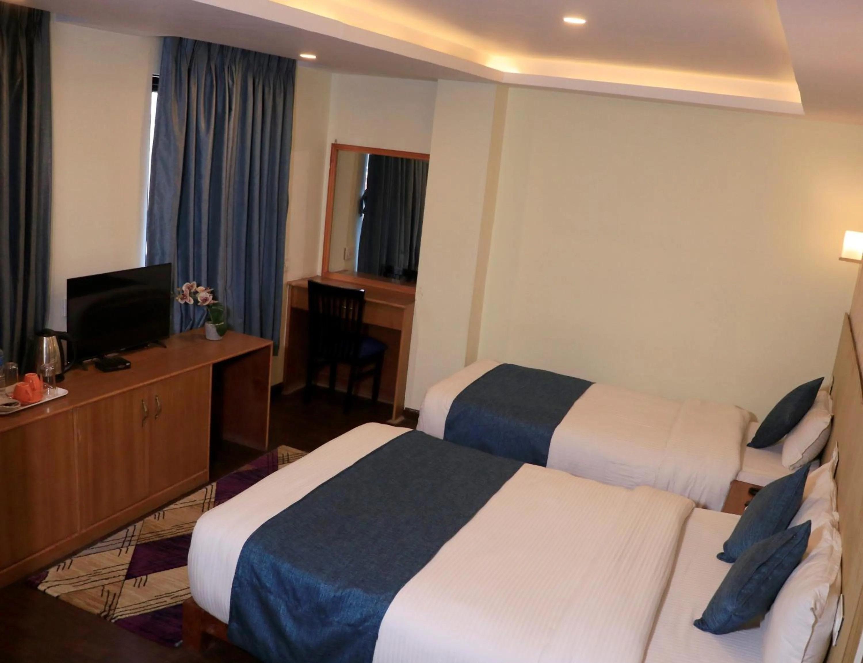 Bed in Satkar Hotel and Spa