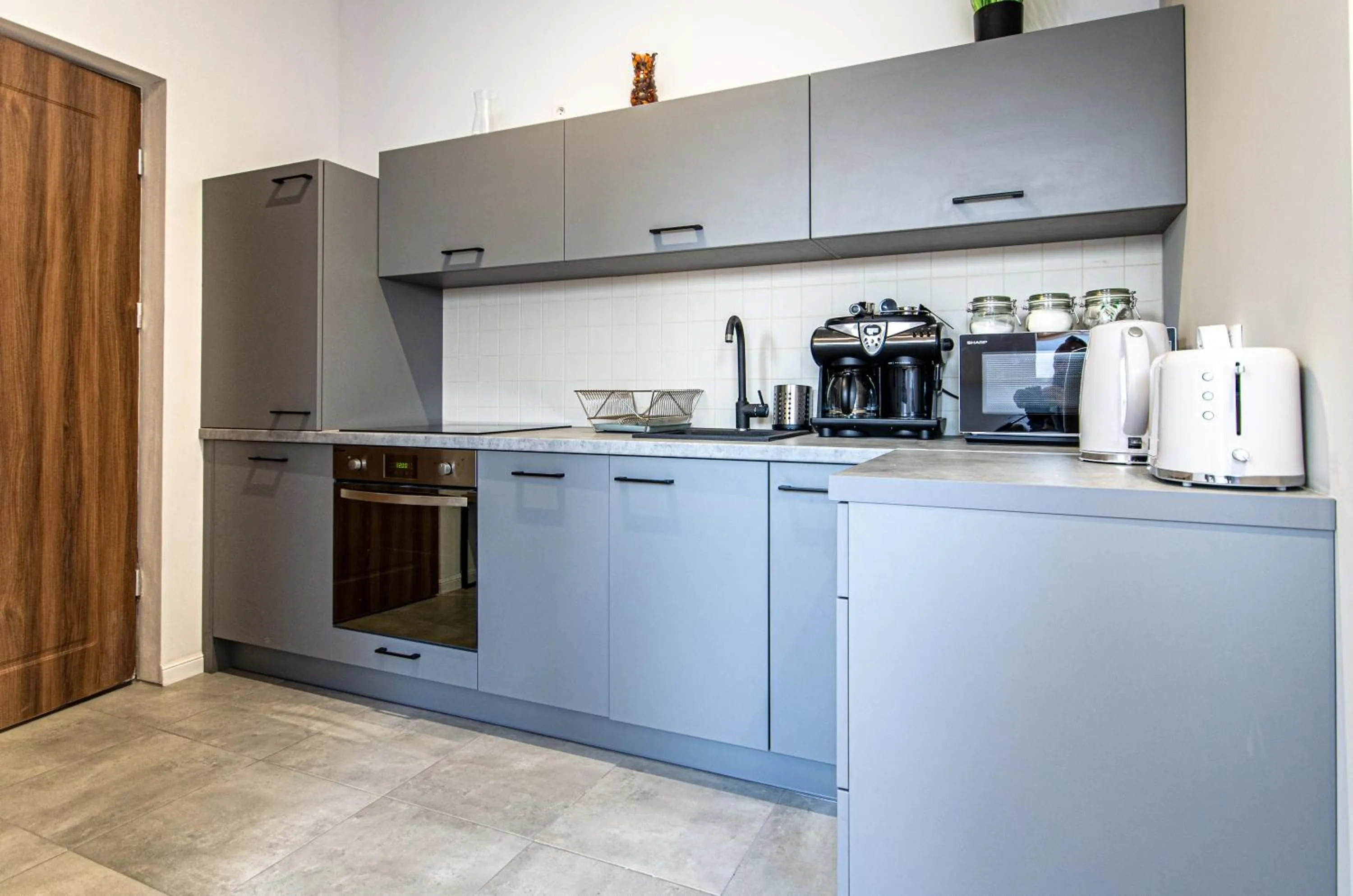 Kitchen or kitchenette in Old Town Vistula Premium Apartments
