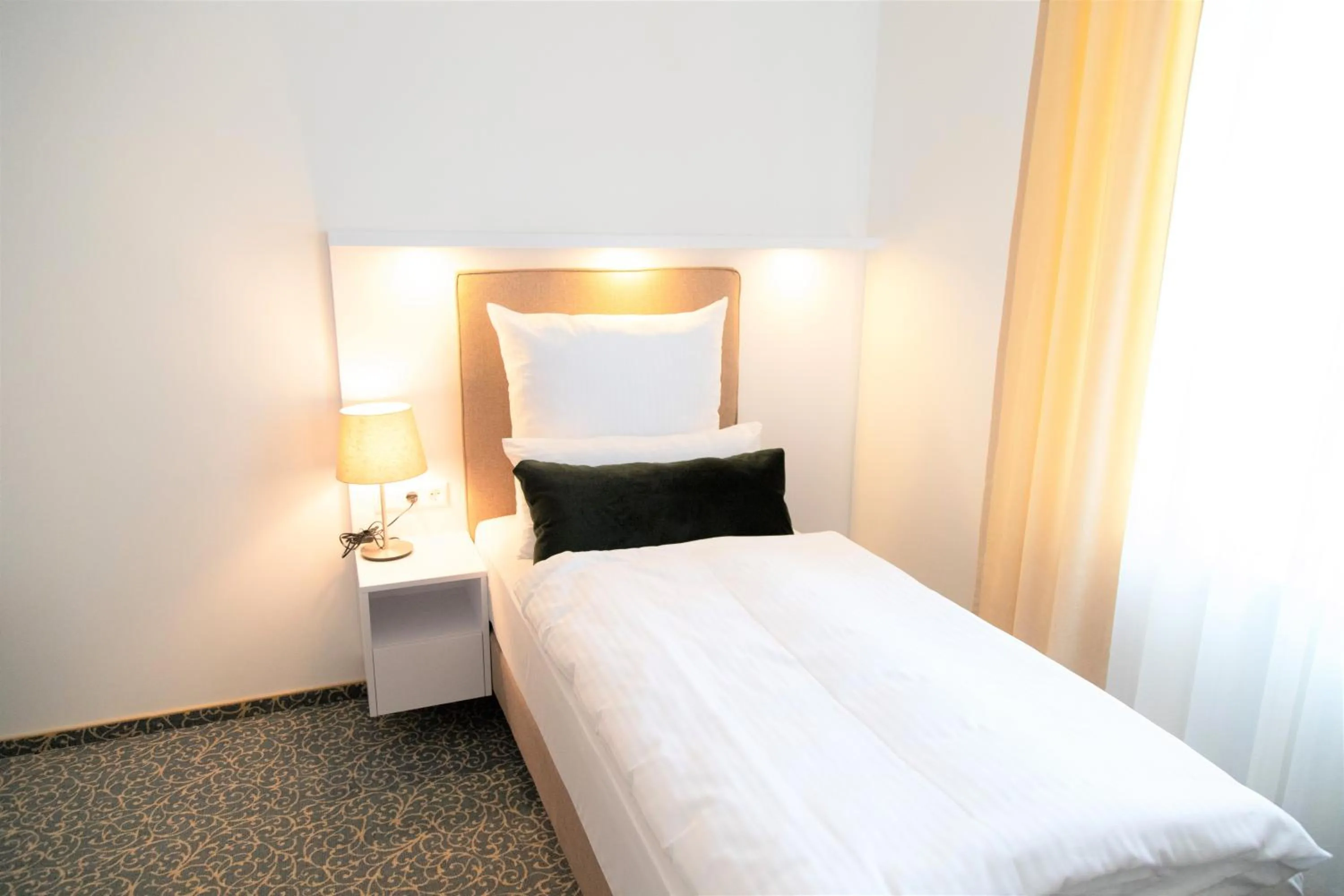 Bed in Amplidi Hotel Hannover