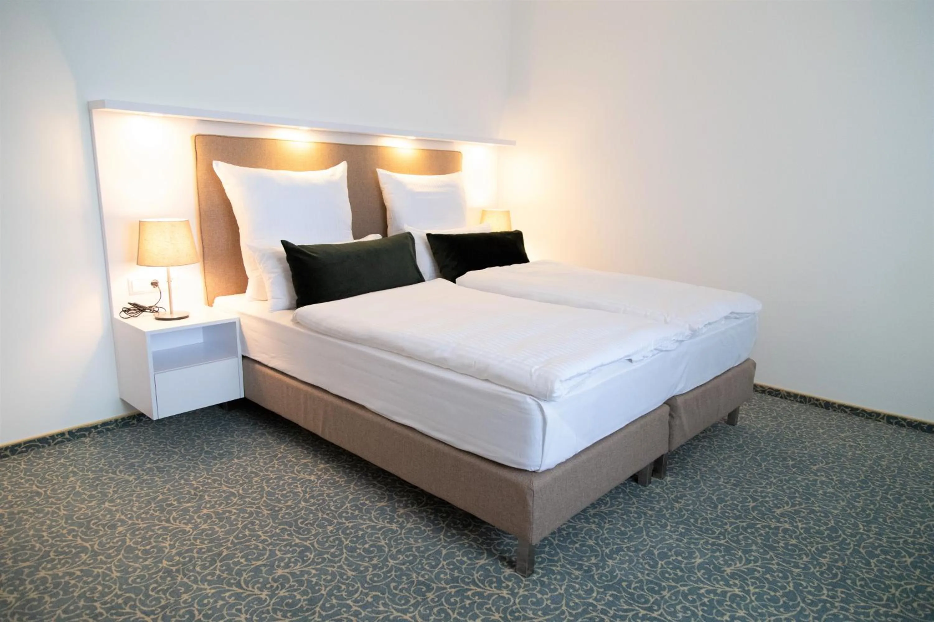 Bed in Amplidi Hotel Hannover