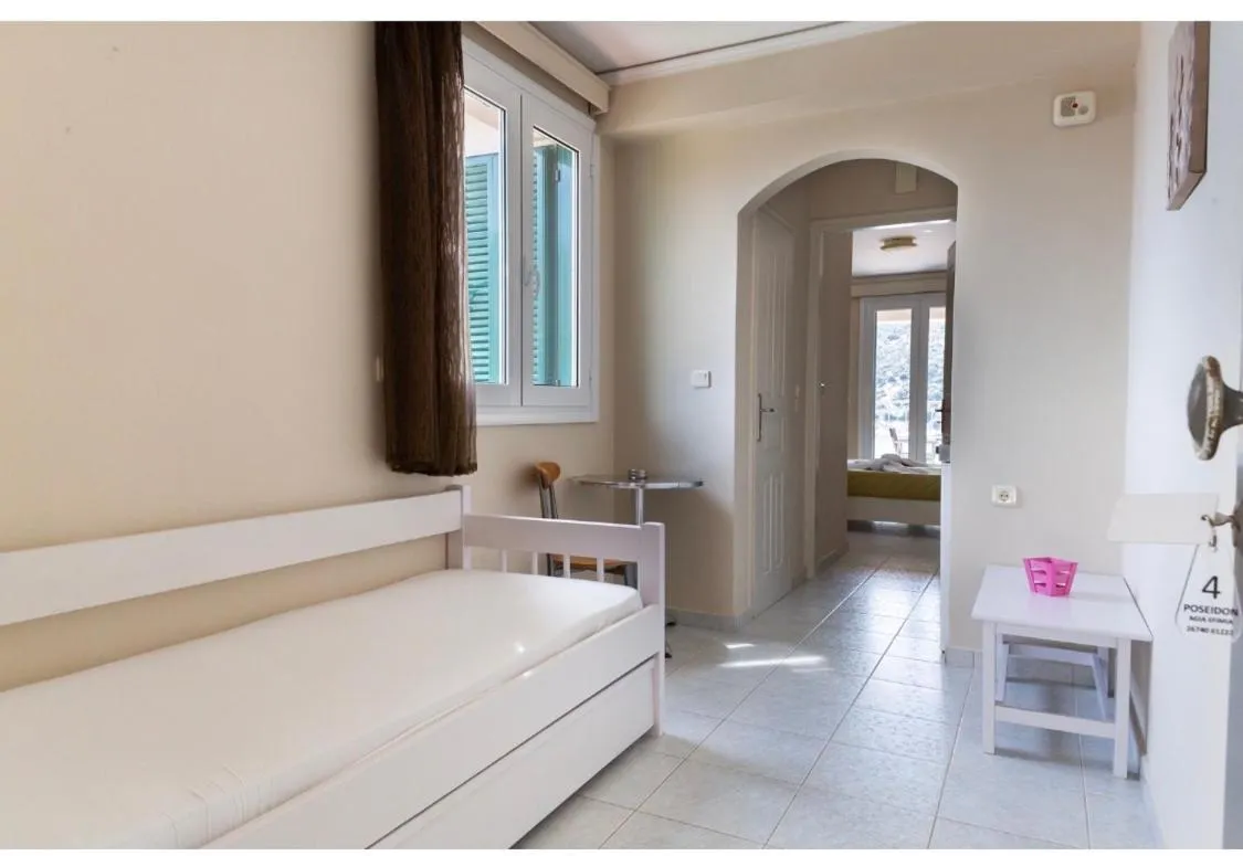 Bed in Poseidon Apartments