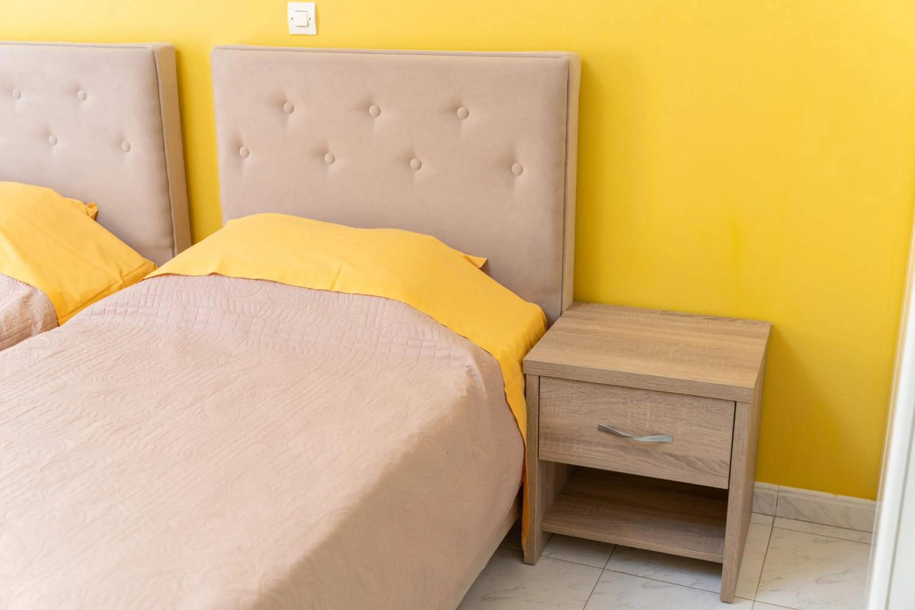 Bed in Remezzo Apartments