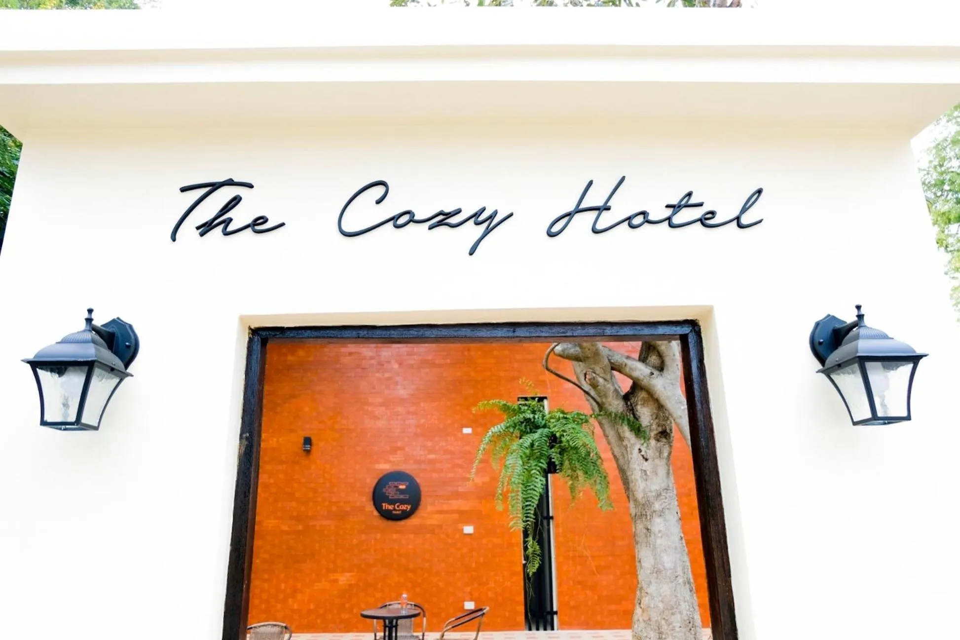 Property logo or sign in The Cozy Hotel