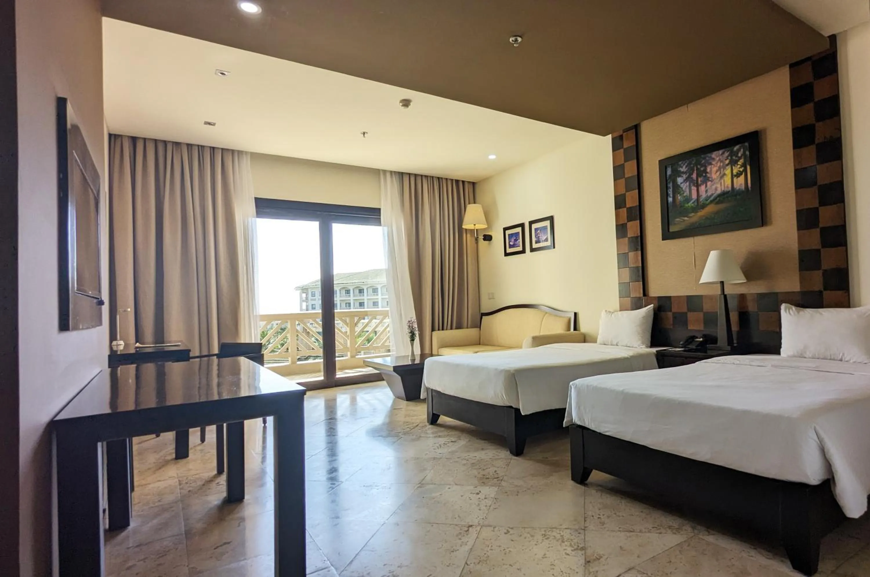 Bed in Olalani Resort & Condotel