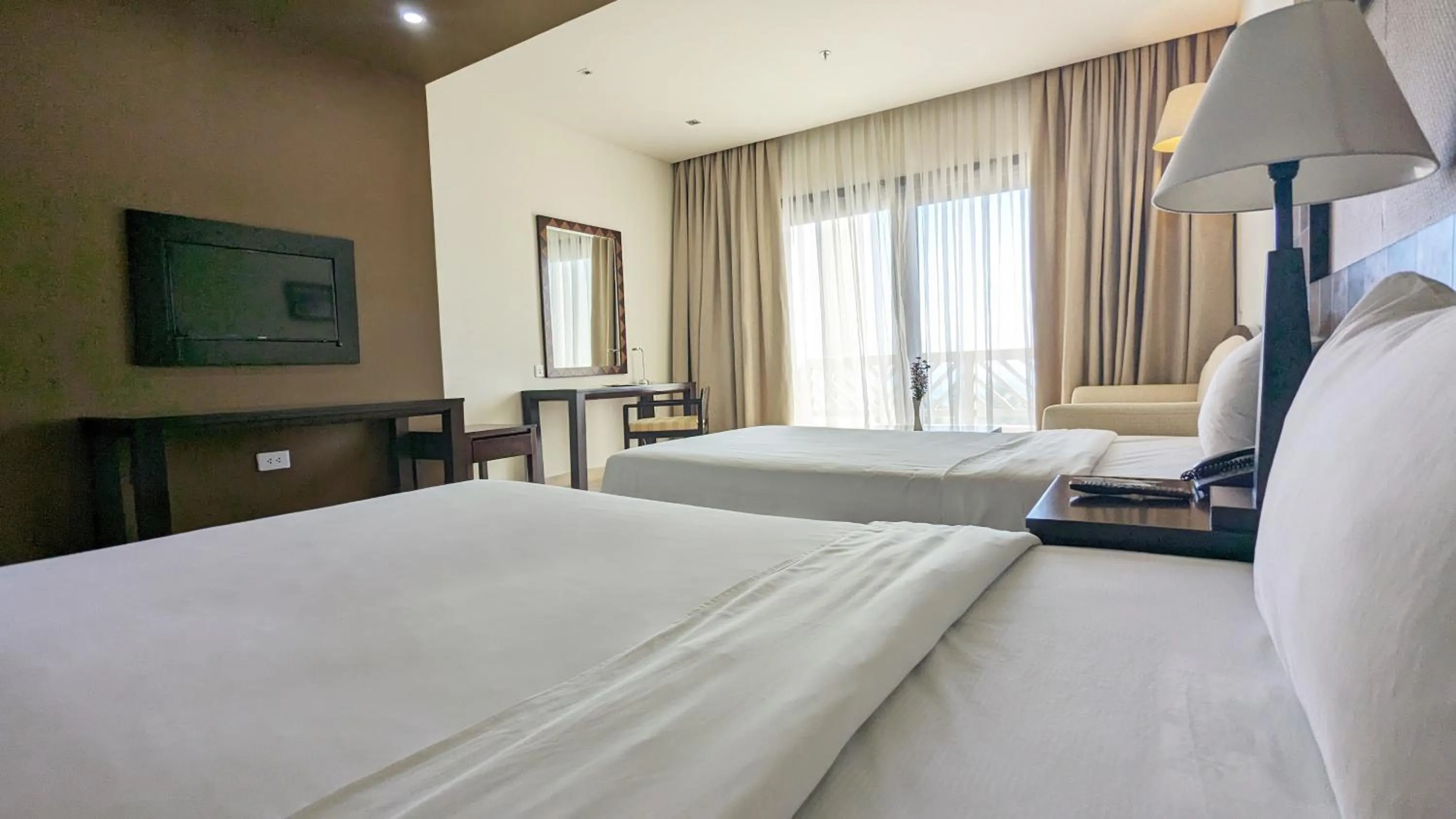 Bed in Olalani Resort & Condotel