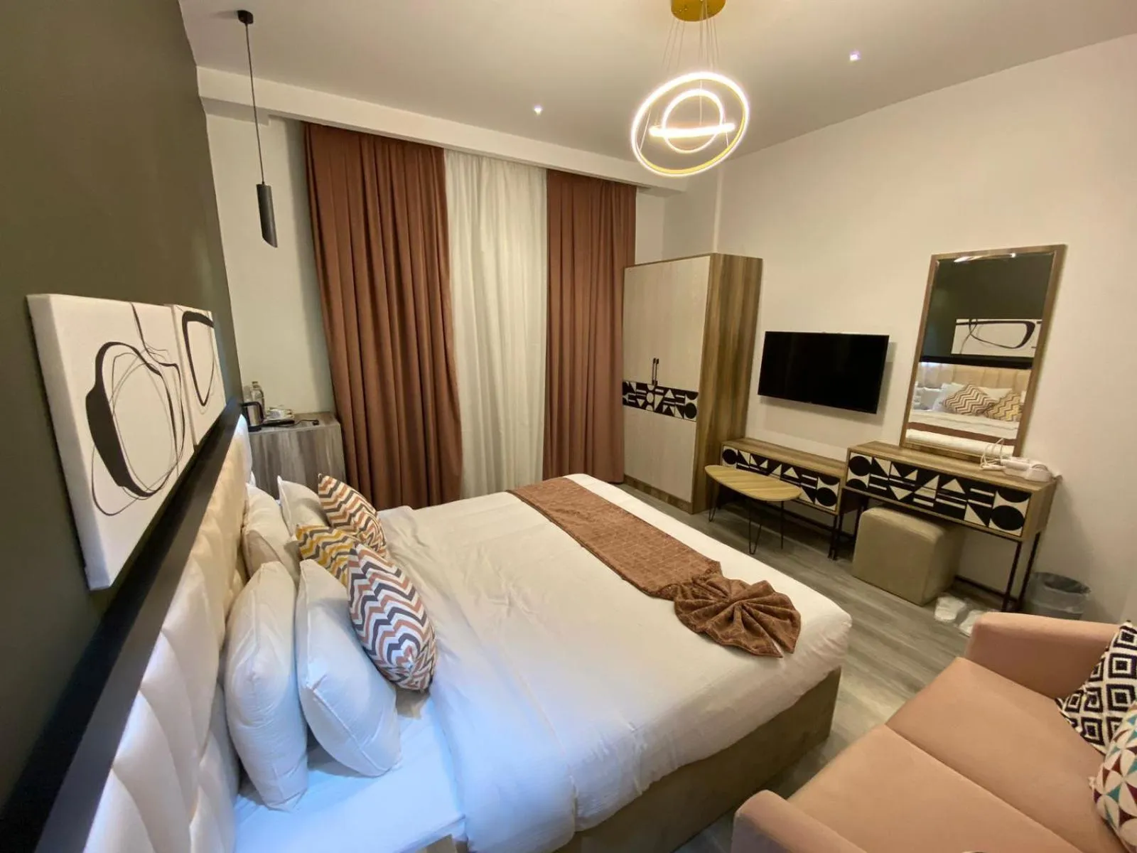 Communal lounge/ TV room, Bed in Elite Pyramids Boutique Hotel