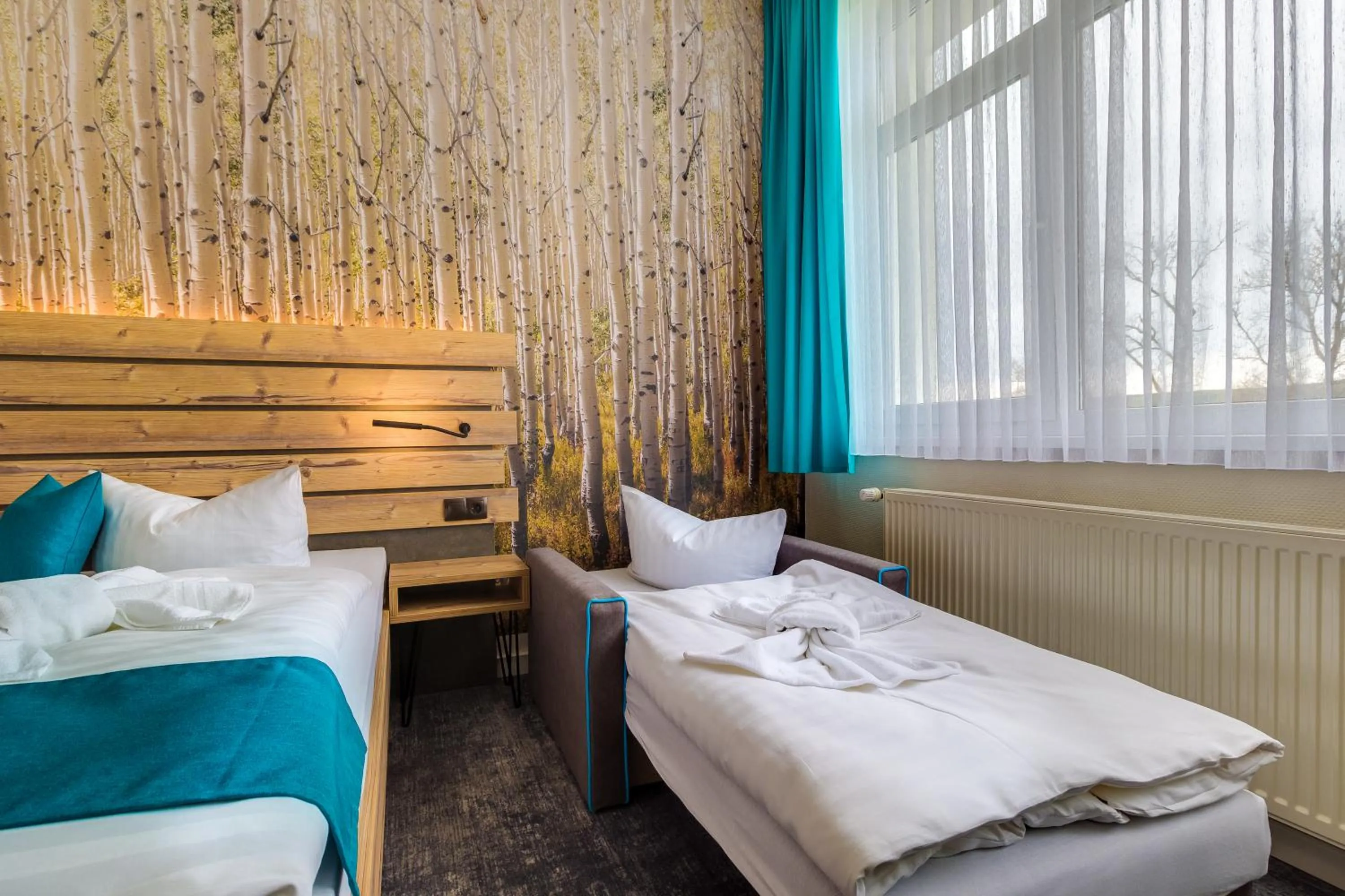 Photo of the whole room, Bed in Panorama Ferien Hotel Harz