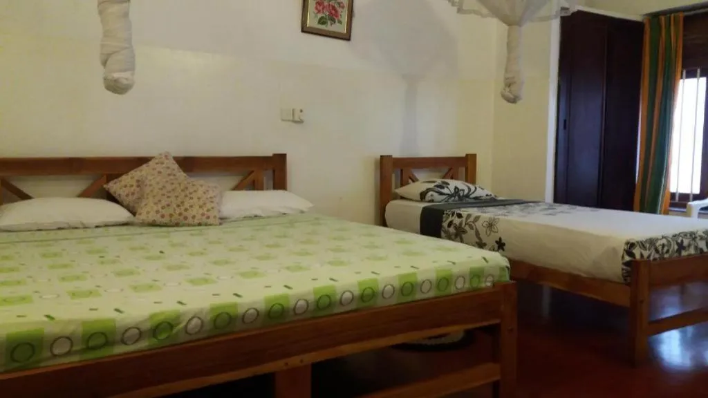 Bed in Hotel Mango Garden