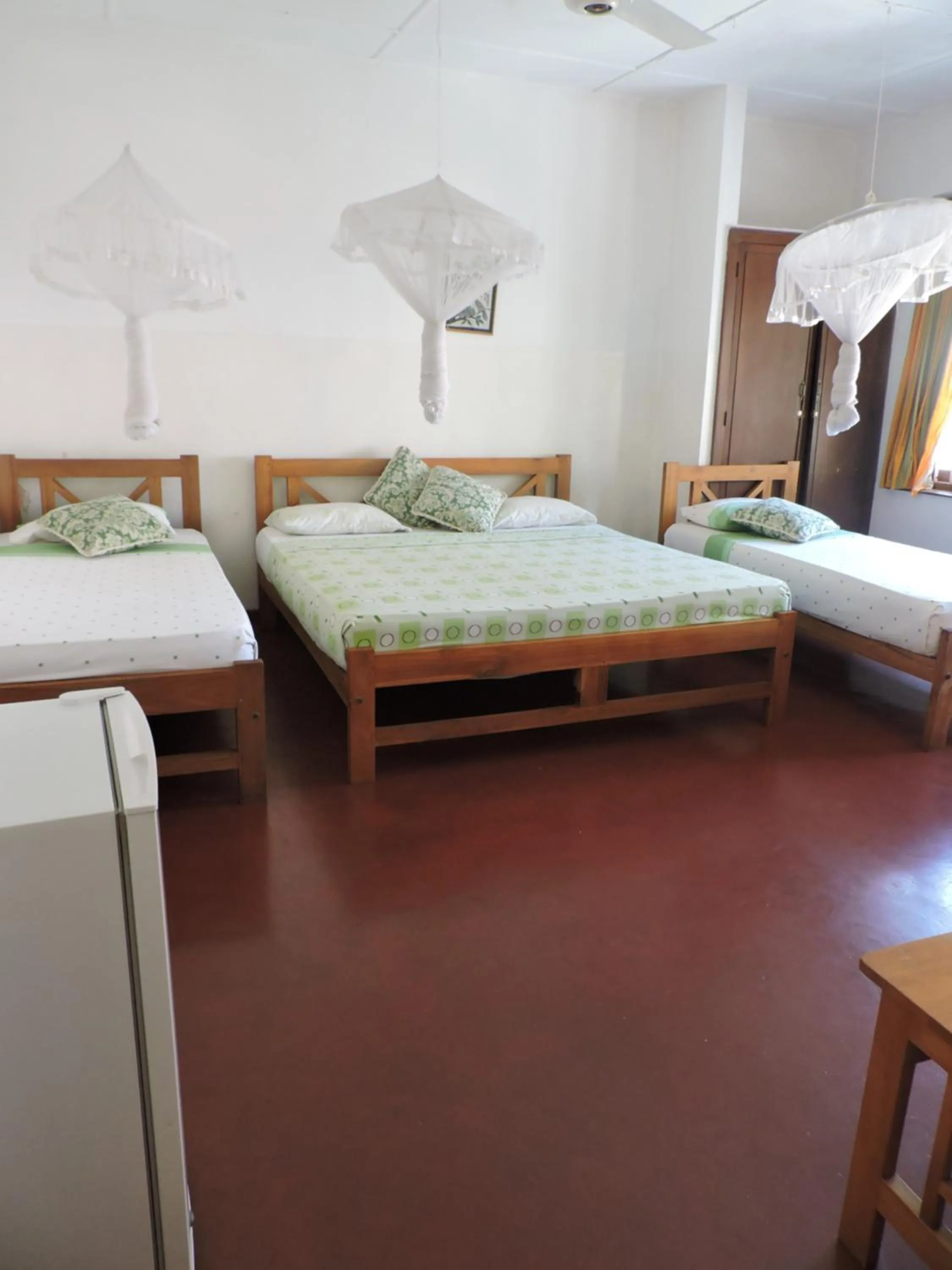 Bed in Hotel Mango Garden