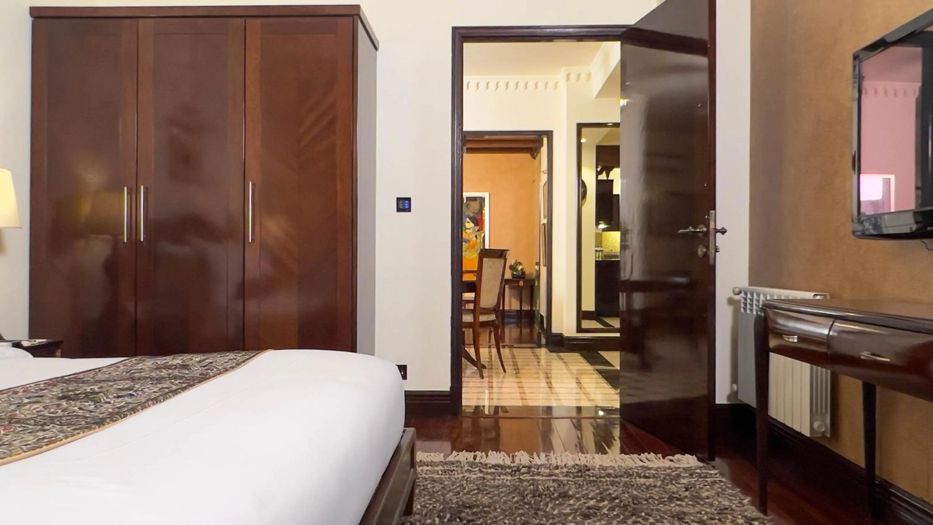 Bed in Heritage Luxury Suites All Suite Hotel