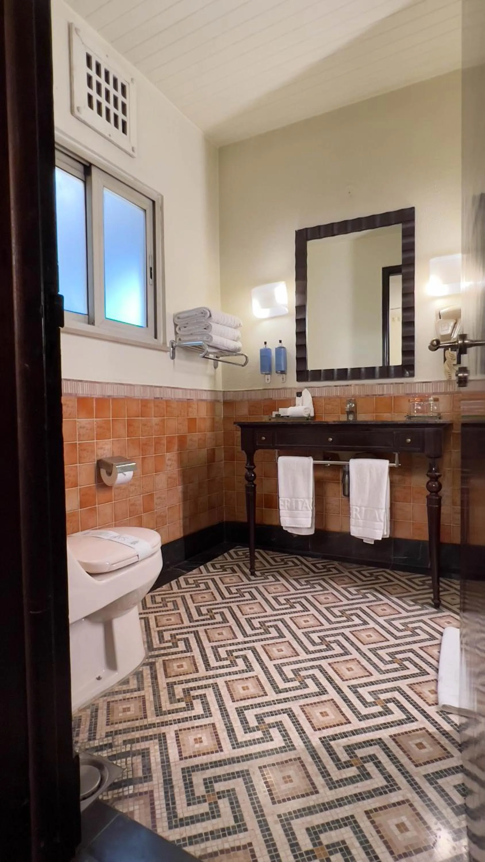 Toilet in Heritage Luxury Suites All Suite Hotel