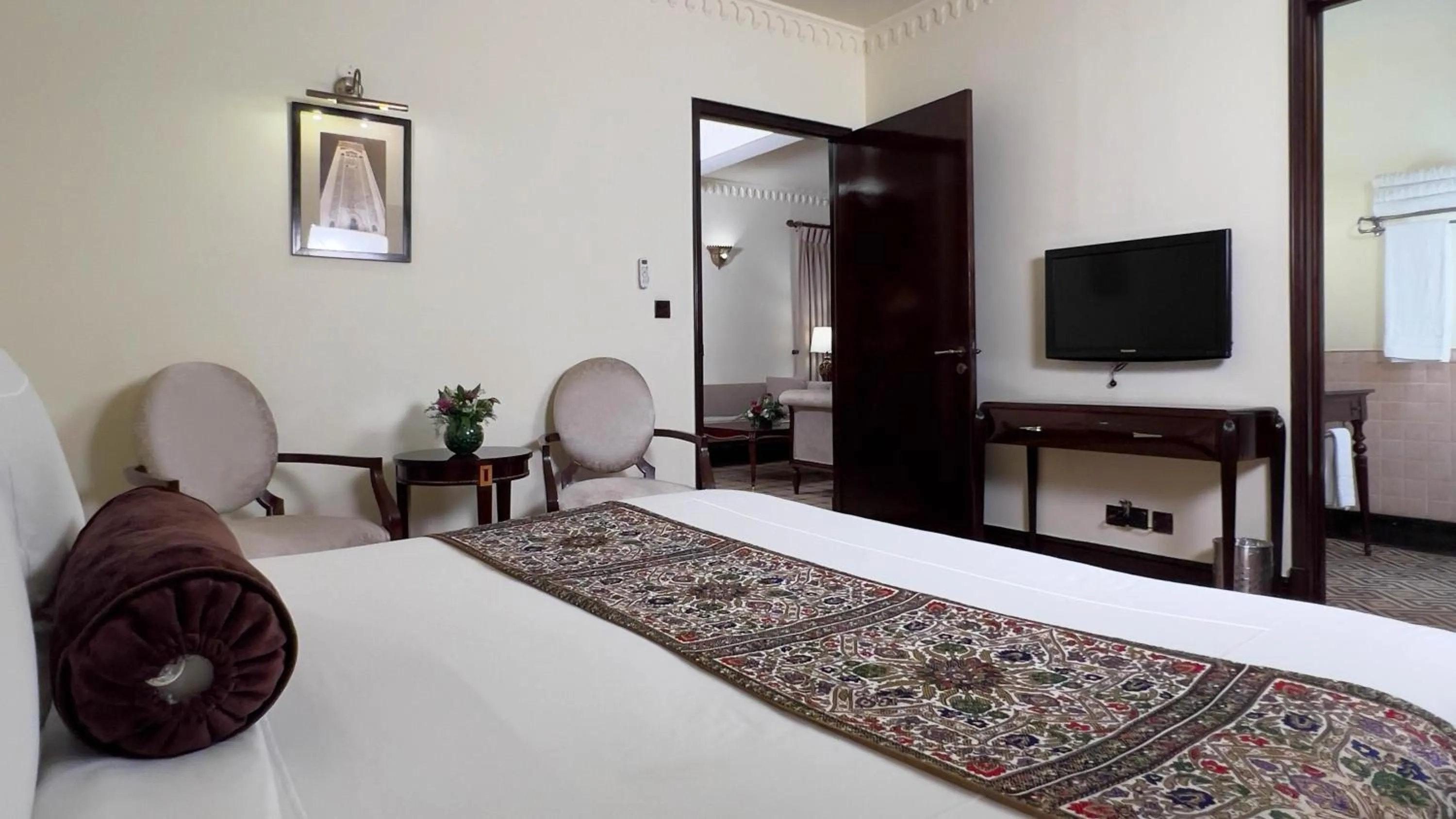 Bed in Heritage Luxury Suites All Suite Hotel