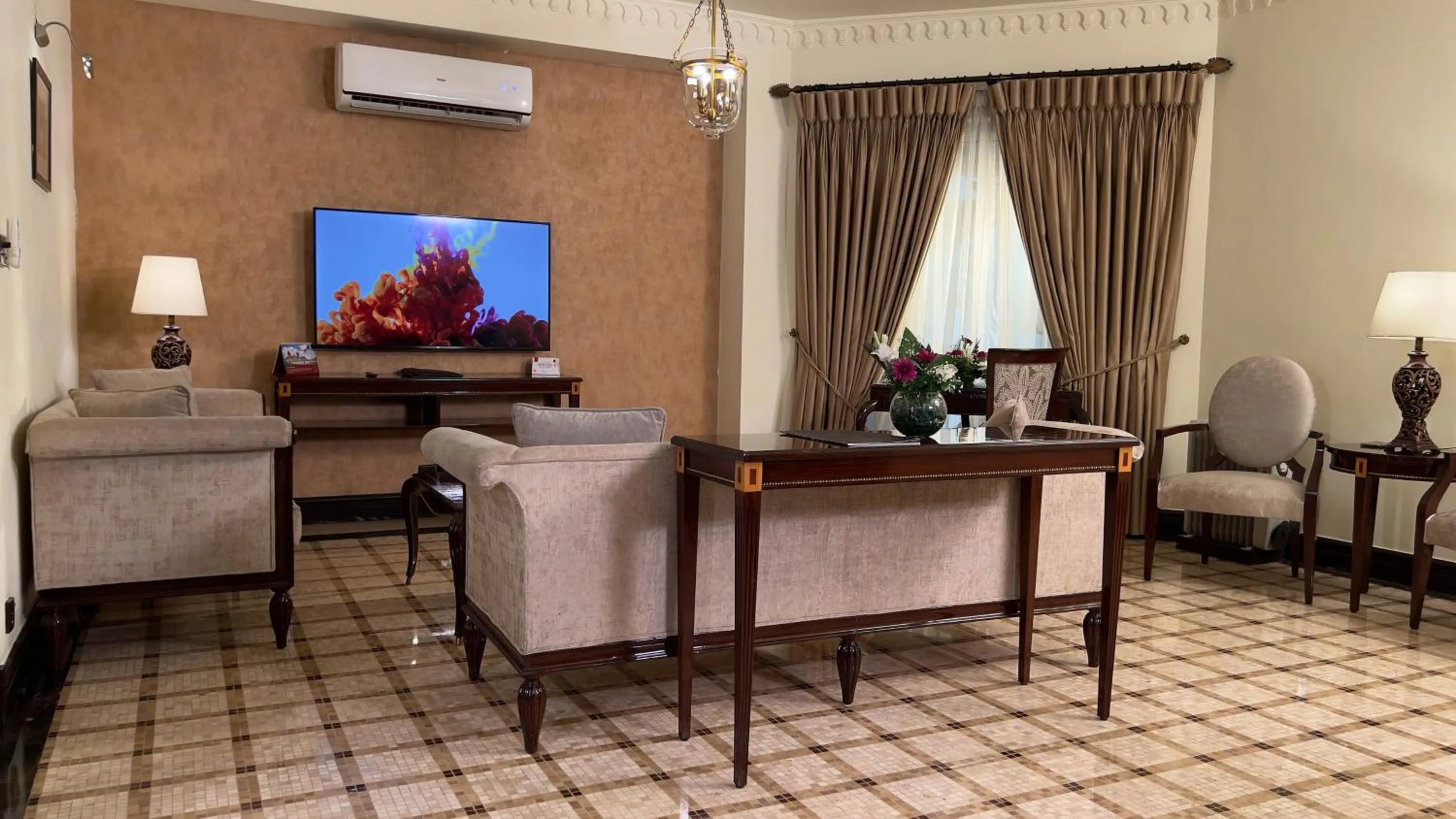 TV and multimedia in Heritage Luxury Suites All Suite Hotel