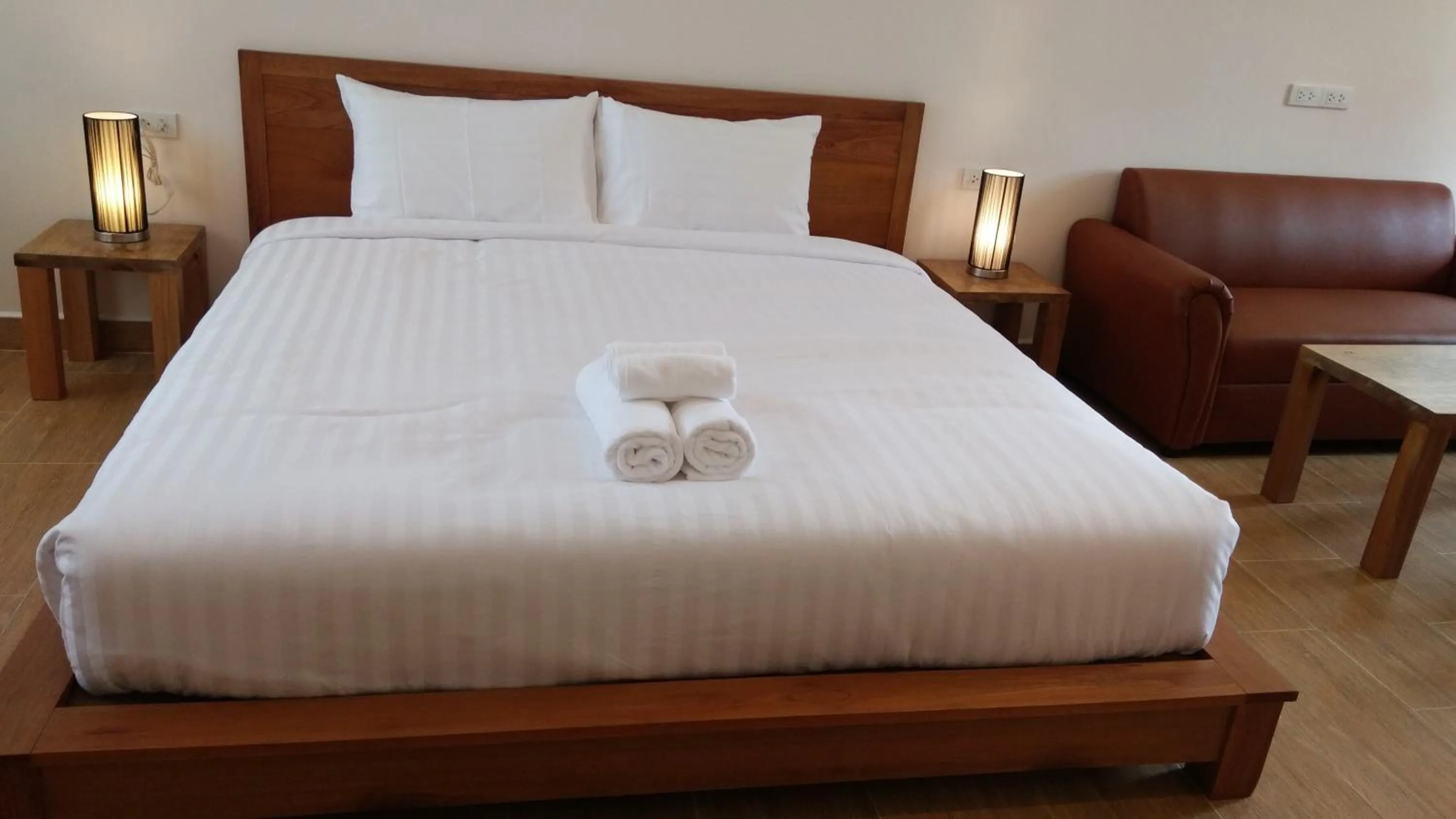 Bed in Le Grand Bleu Hotel