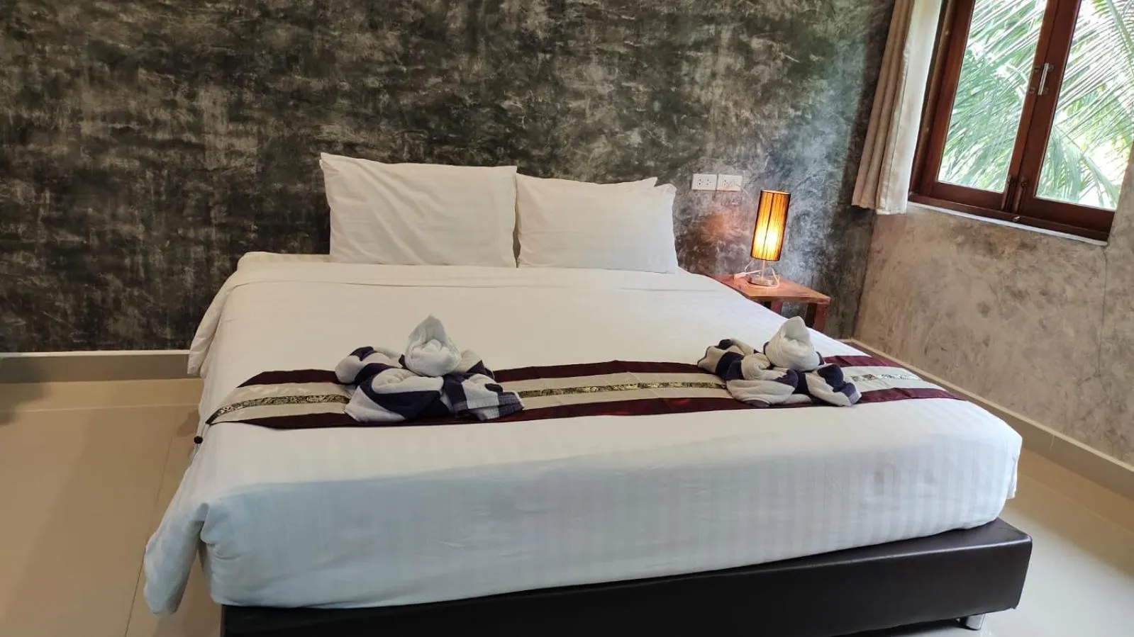 Bed in Le Grand Bleu Hotel