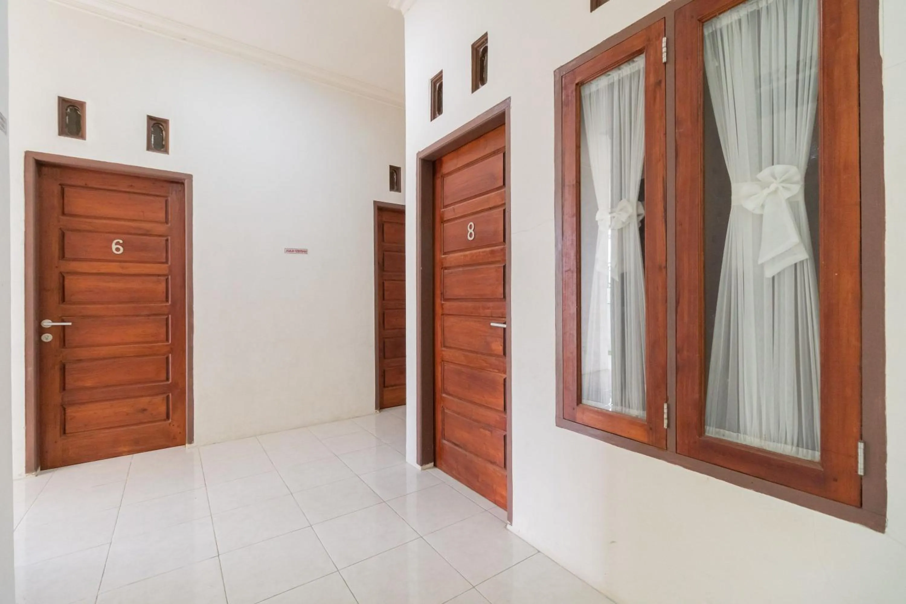 Facade/entrance in RedDoorz Syariah at D'Ostha Residence