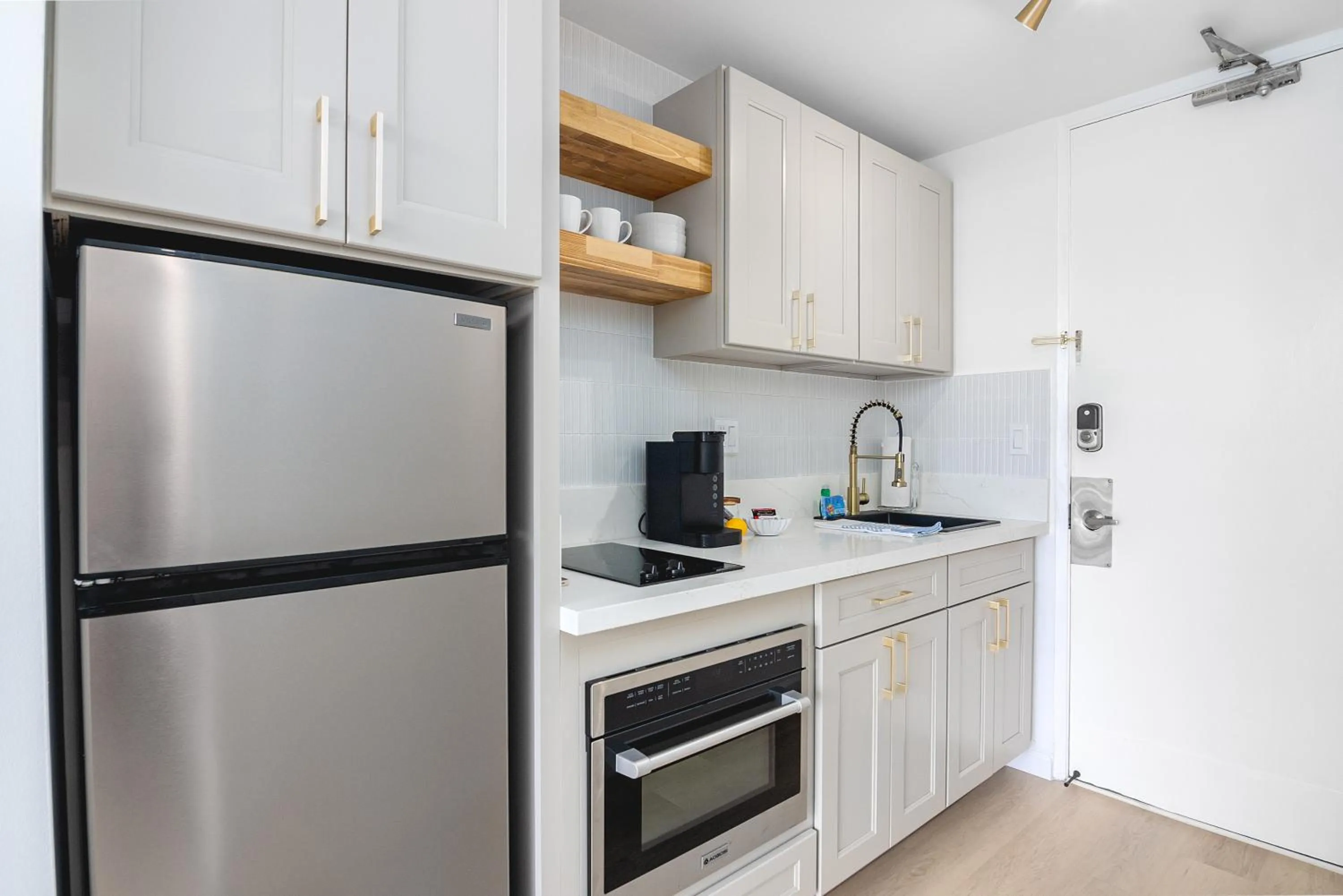 Kitchen or kitchenette in Steps to Waikiki Beach! Newly Renovated with 75" TV