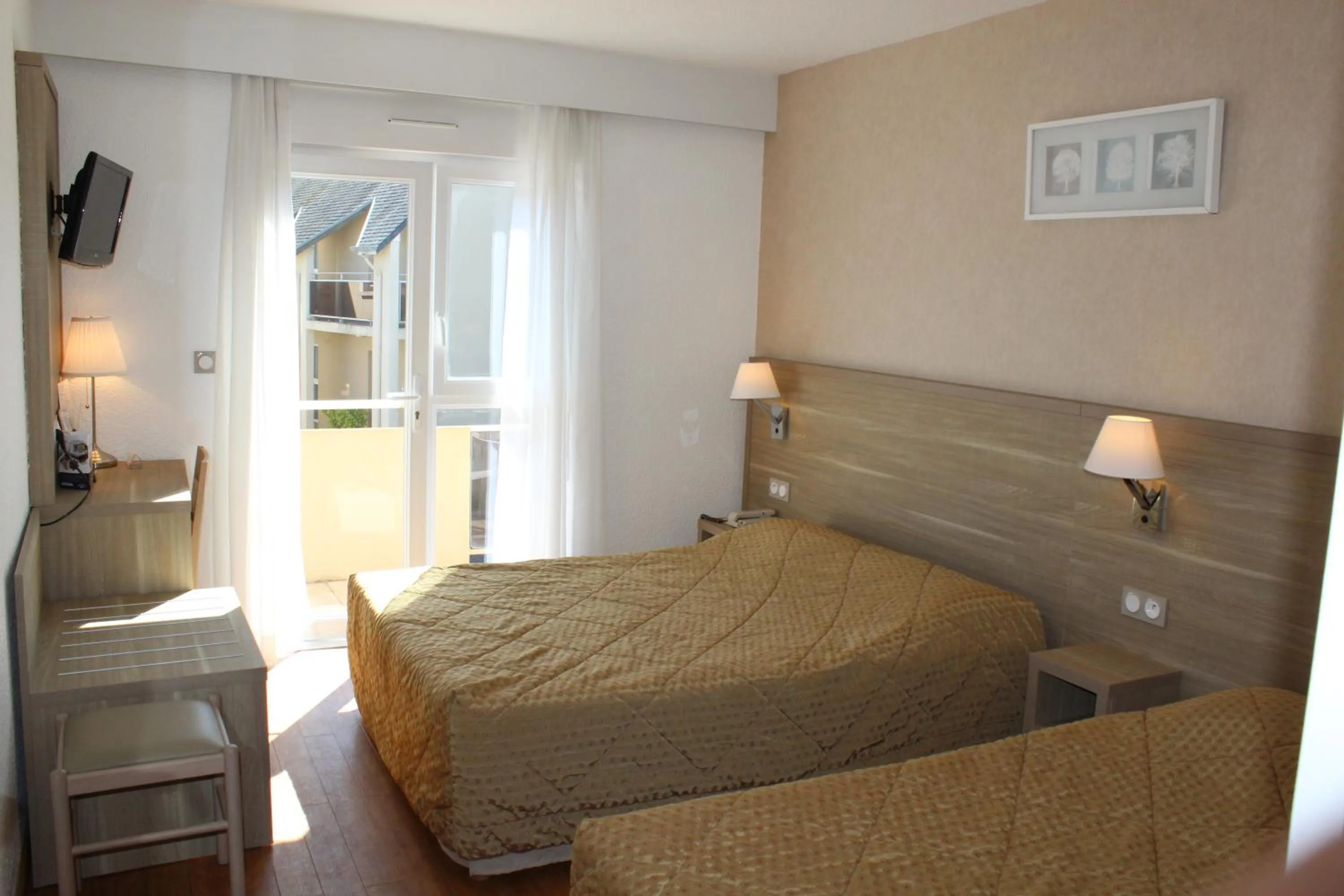 Bed in Hotel Des Tilleuls