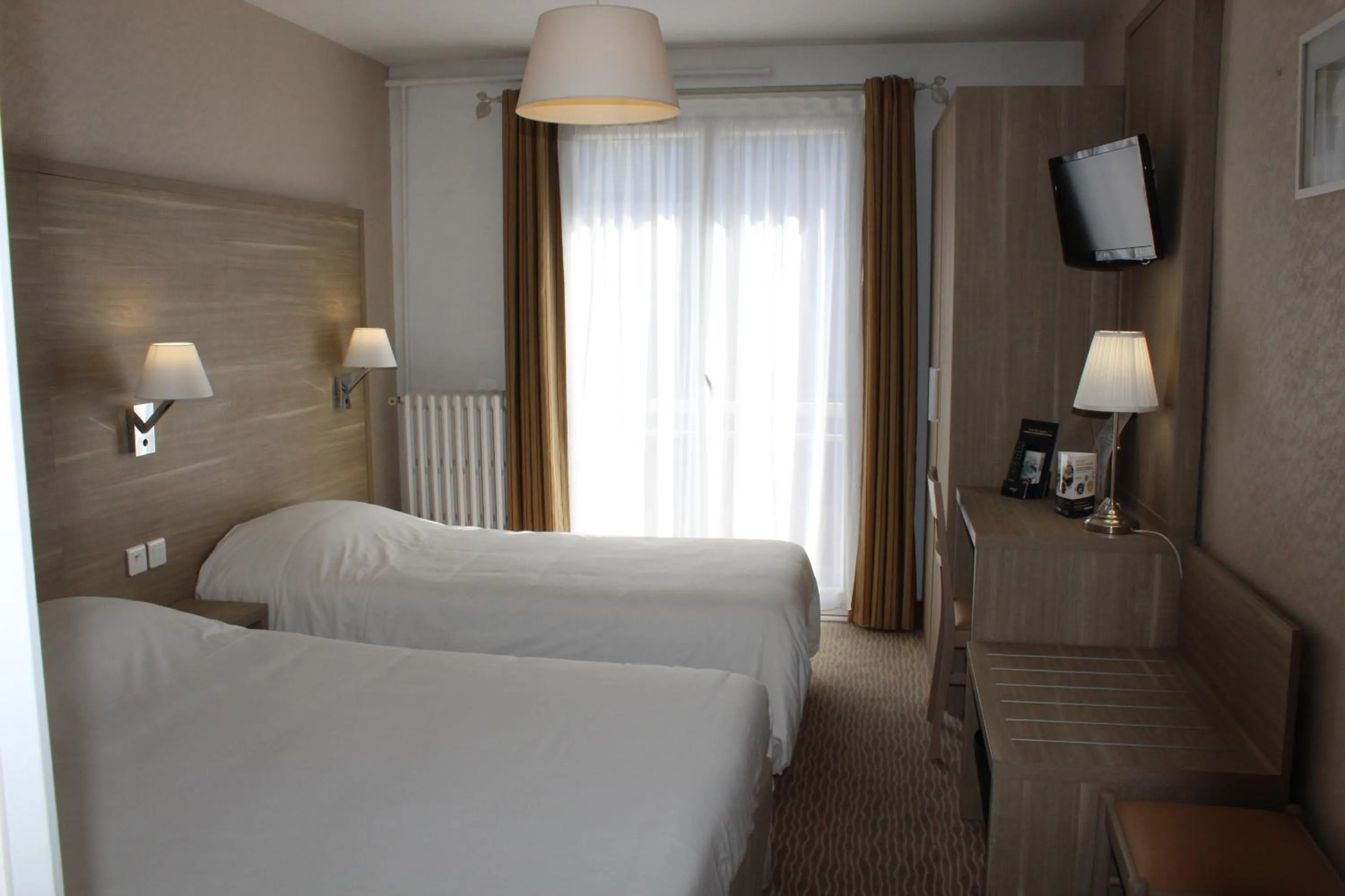 Bed in Hotel Des Tilleuls