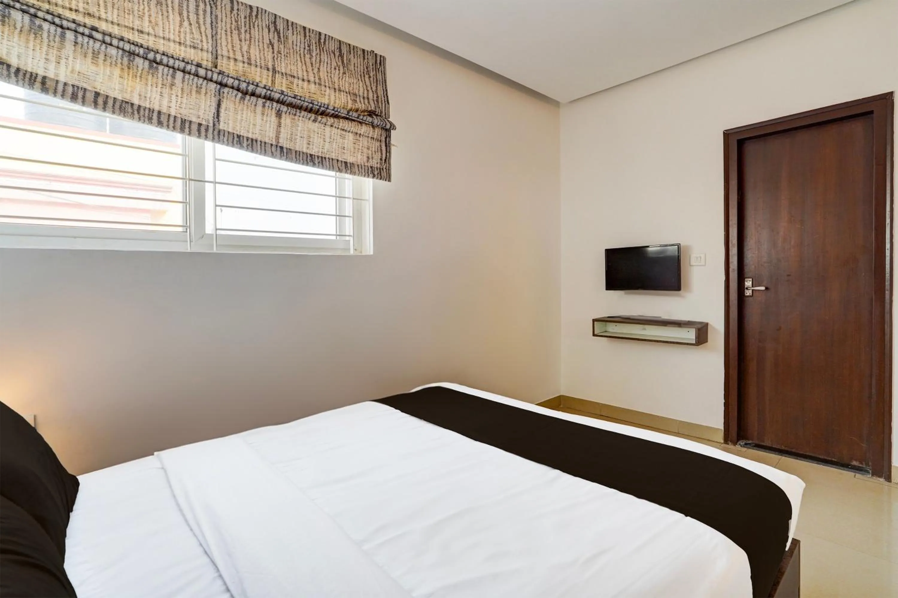 Bedroom, Bed in Super Townhouse Hebbal
