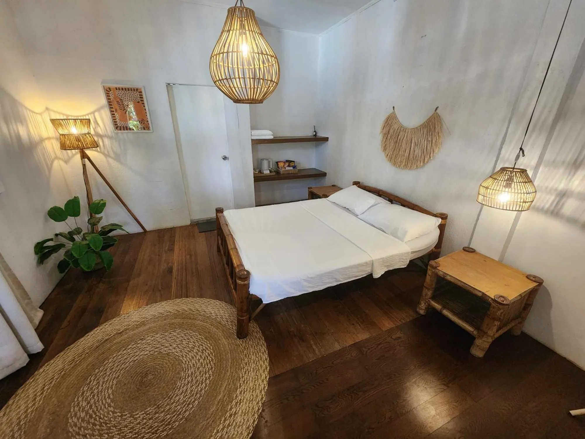 Bed in The Shark's Tail Dive Resort