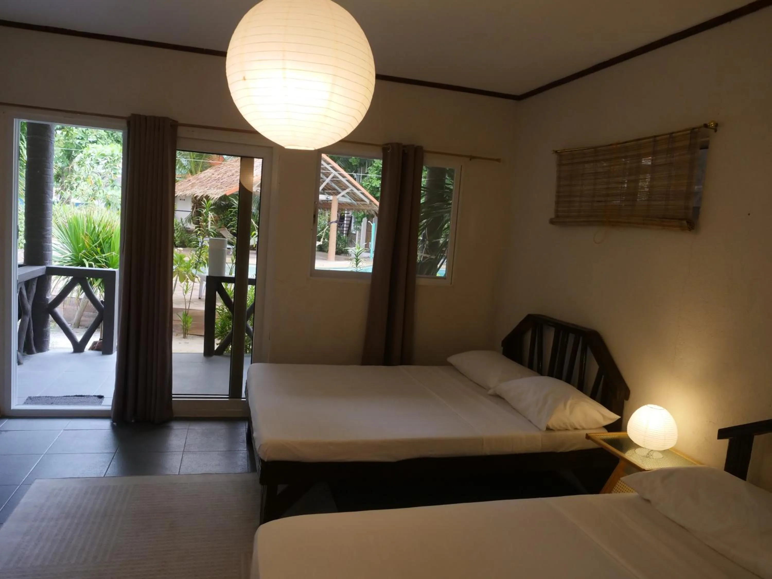 Bed in The Shark's Tail Dive Resort