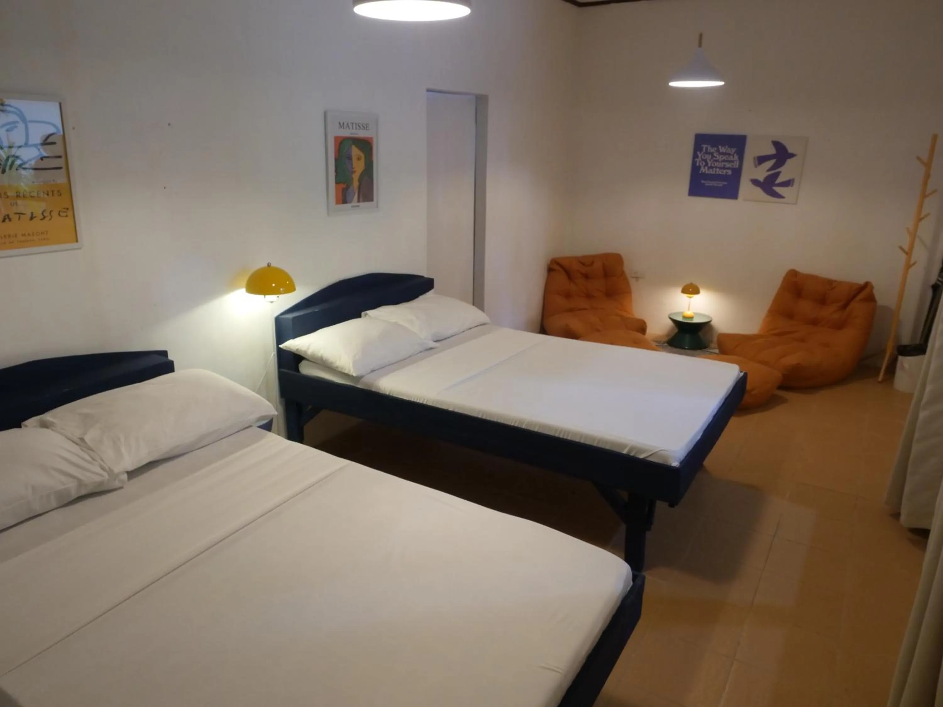 Bed in The Shark's Tail Dive Resort