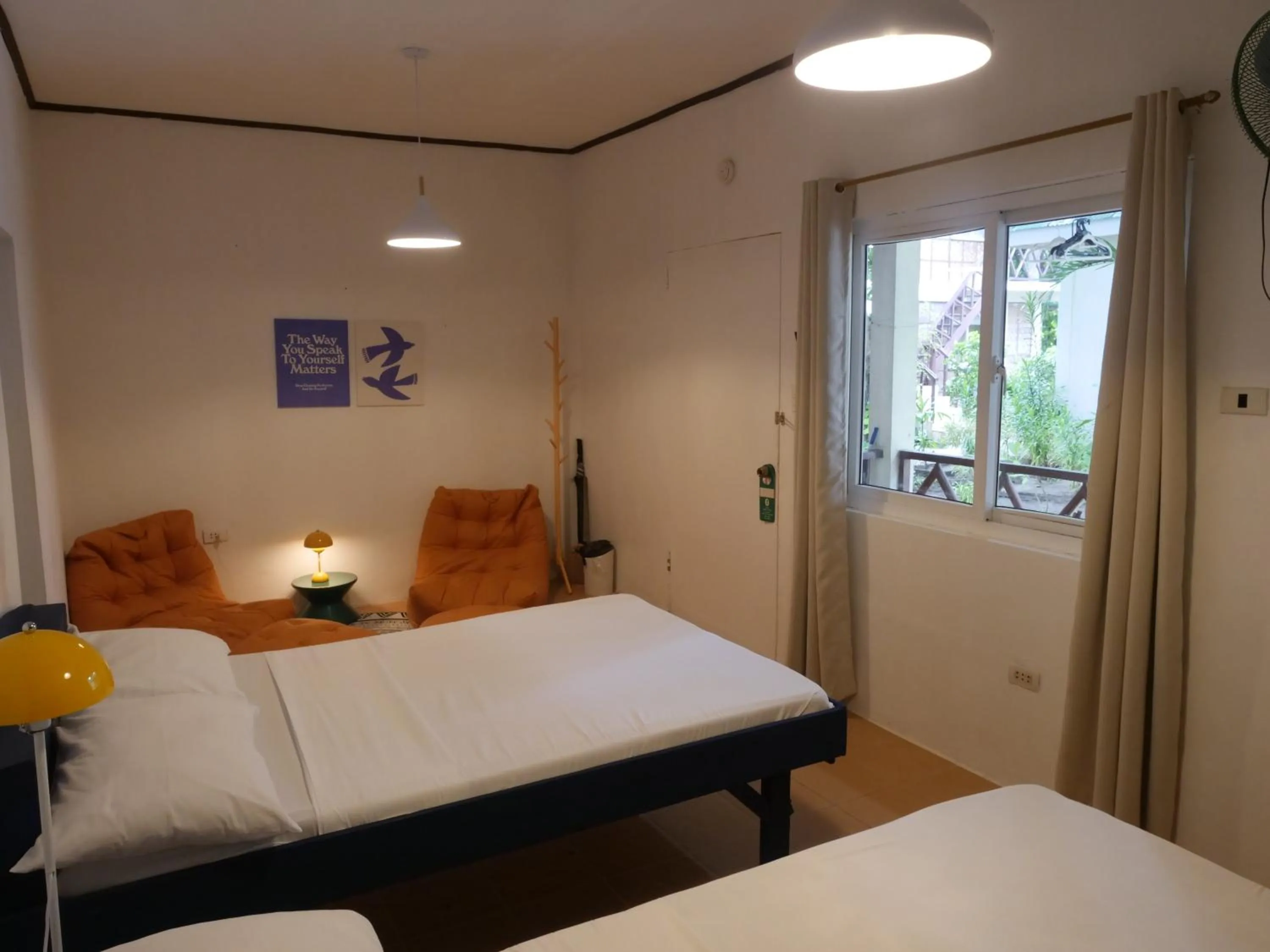 Bed in The Shark's Tail Dive Resort