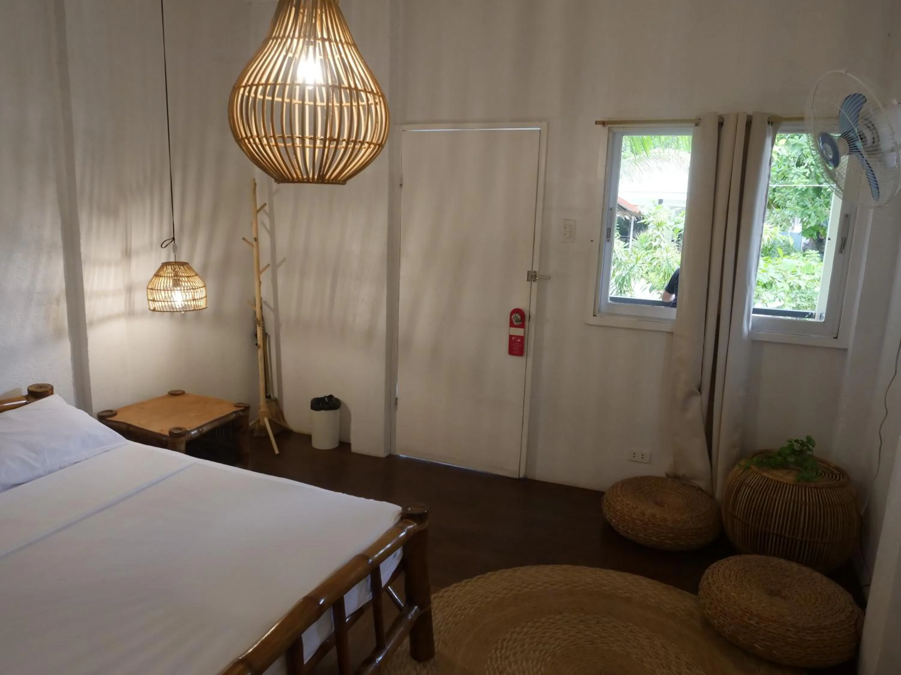 Bed in The Shark's Tail Dive Resort